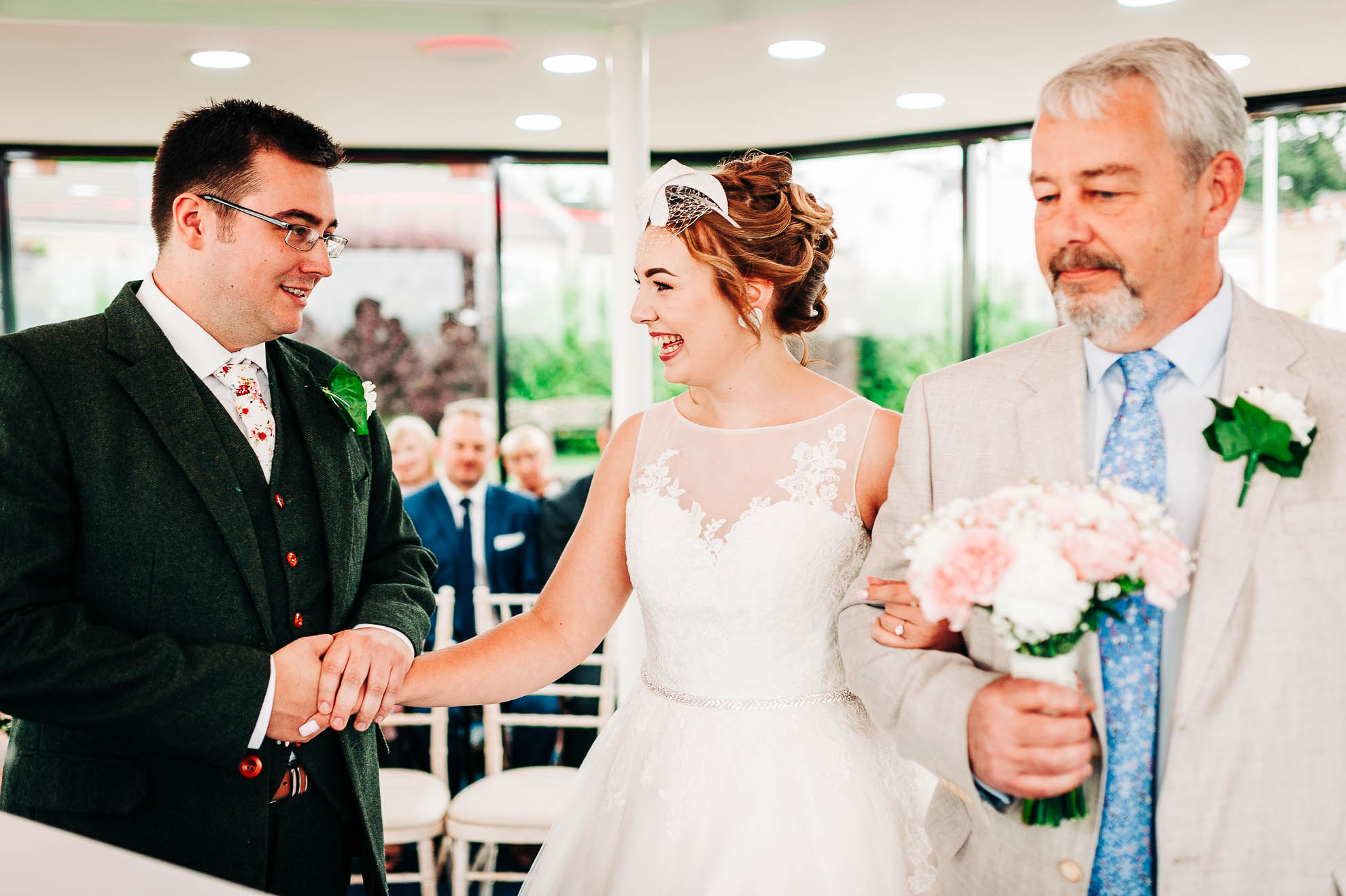 Bride and groom greet each other as the bride arrives at the wedding ceremony