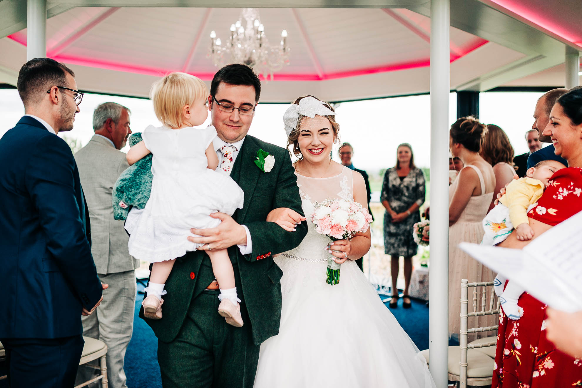 The newly weds walk back down the aisle