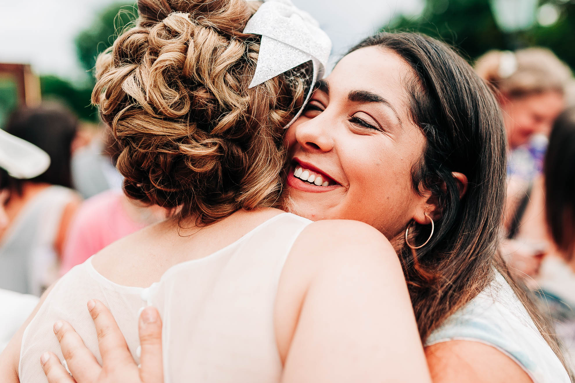 Guest hugs the bride 