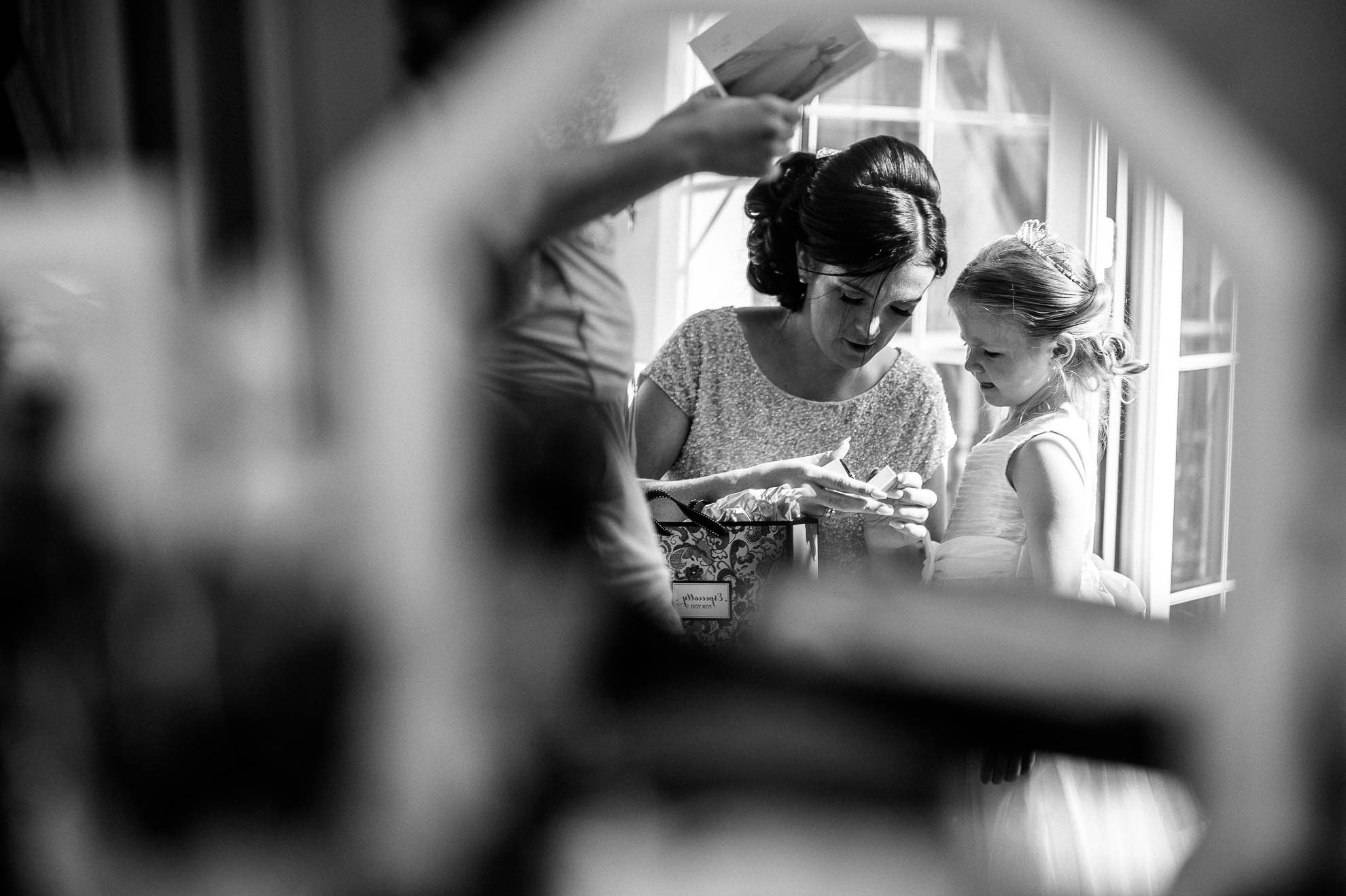 bridesmaid and flower girl in mirror