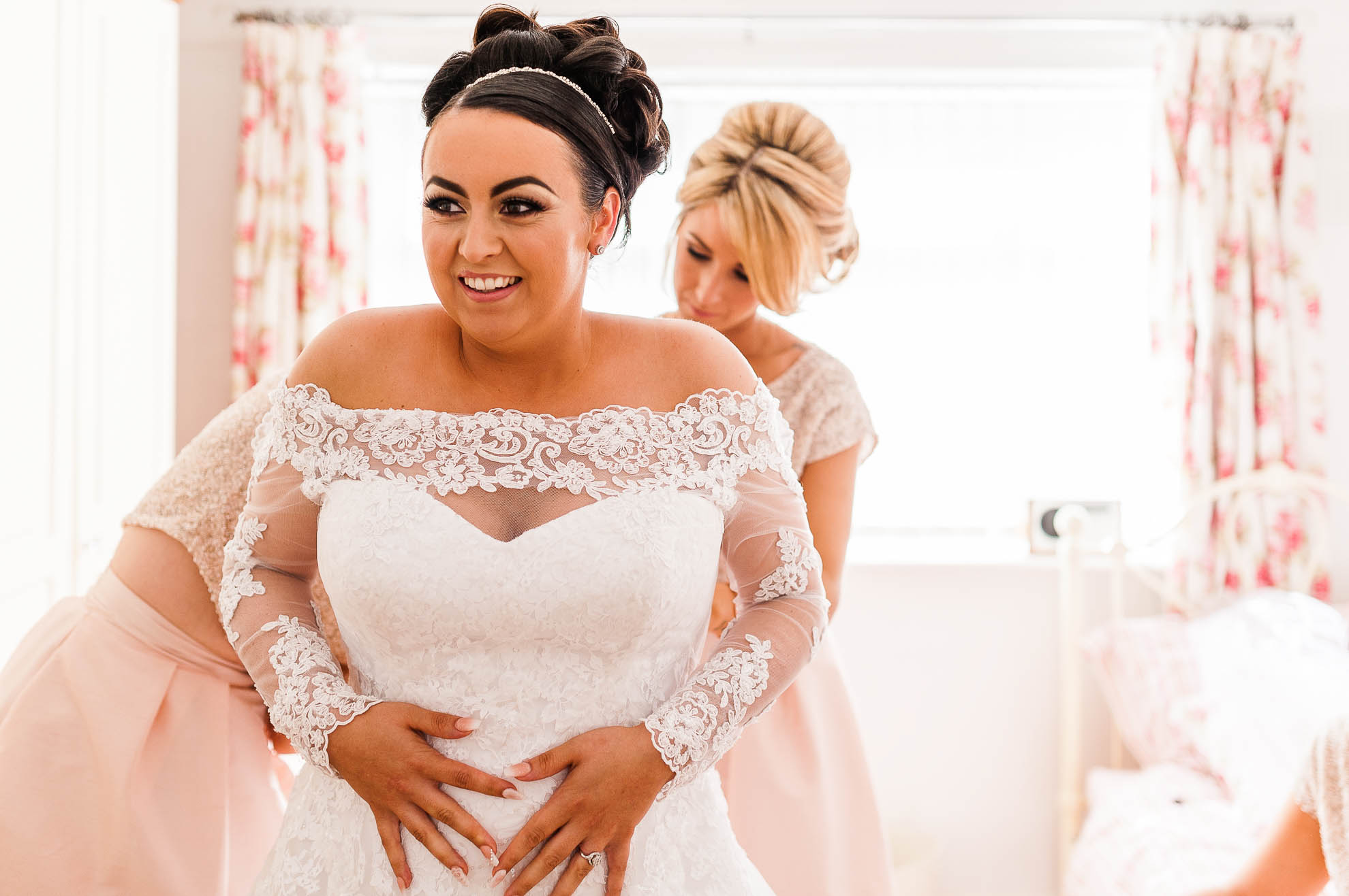 bride puts her dress on