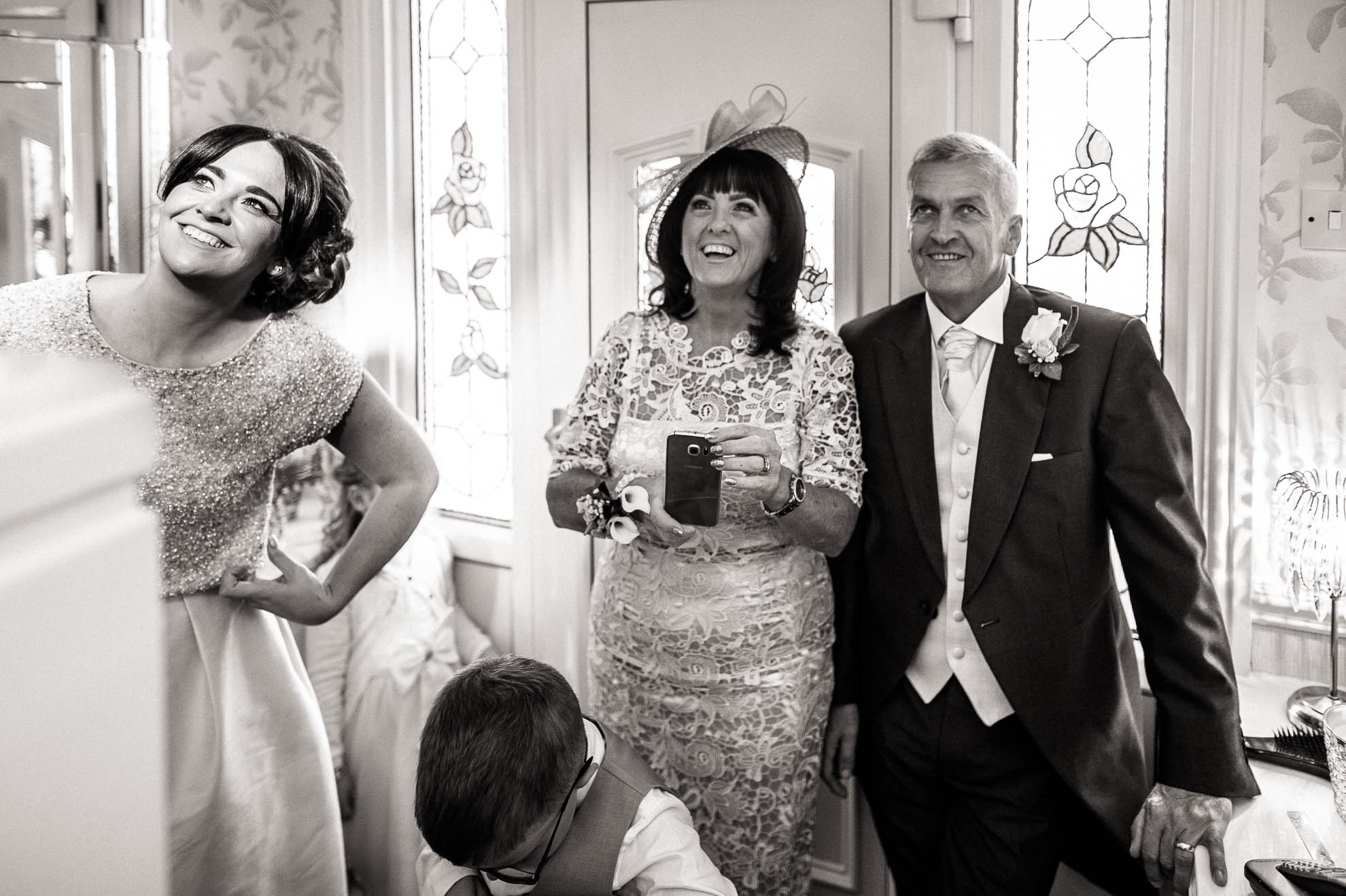 mother and father of the bride see the bride in her dress for the first time