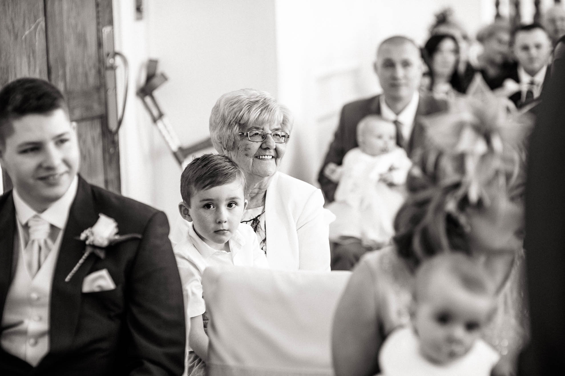 grandmother smiles during the ceremony