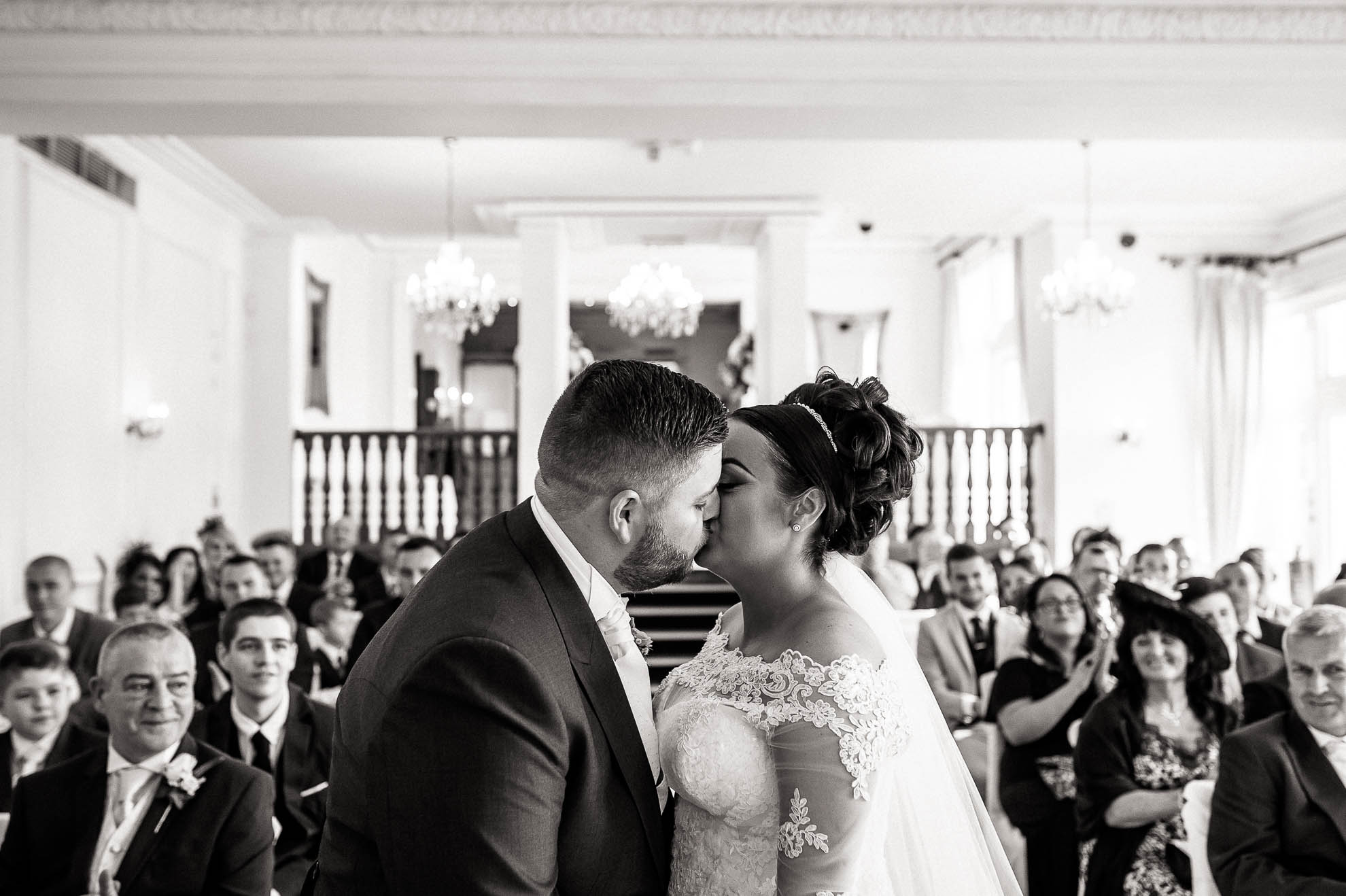 bride and groom first kiss