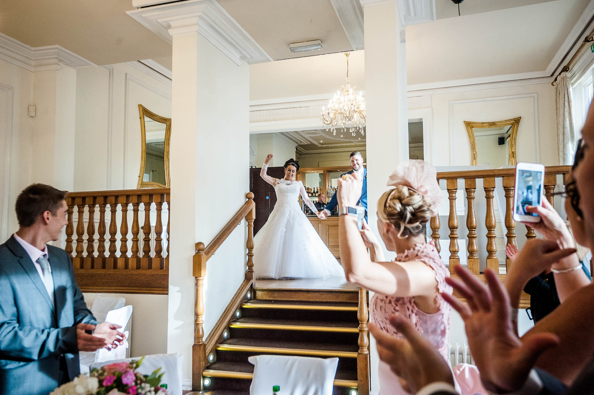 bride and groom enter wedding breakfast