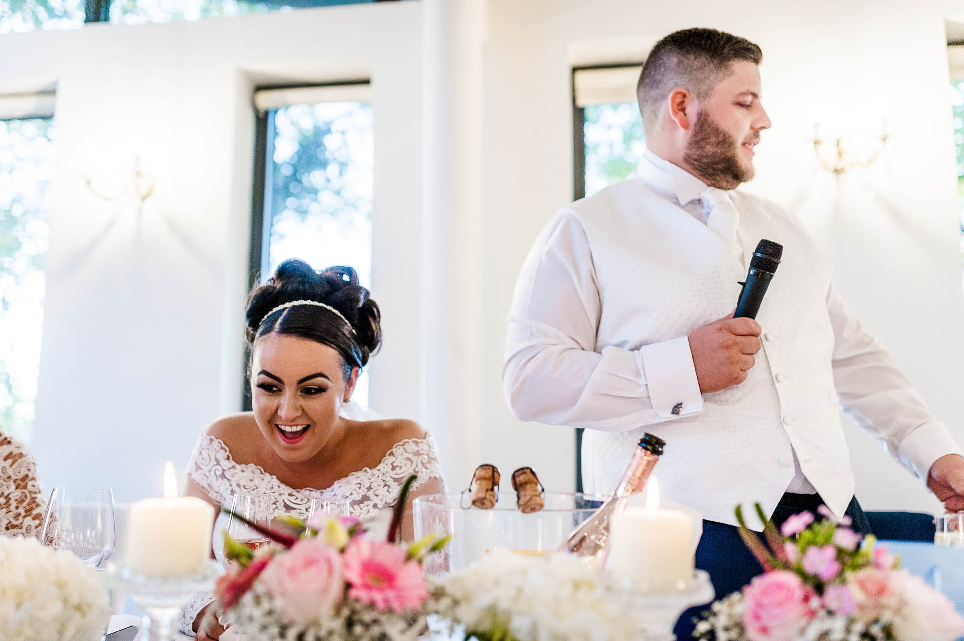 bride laughs at groom's joke