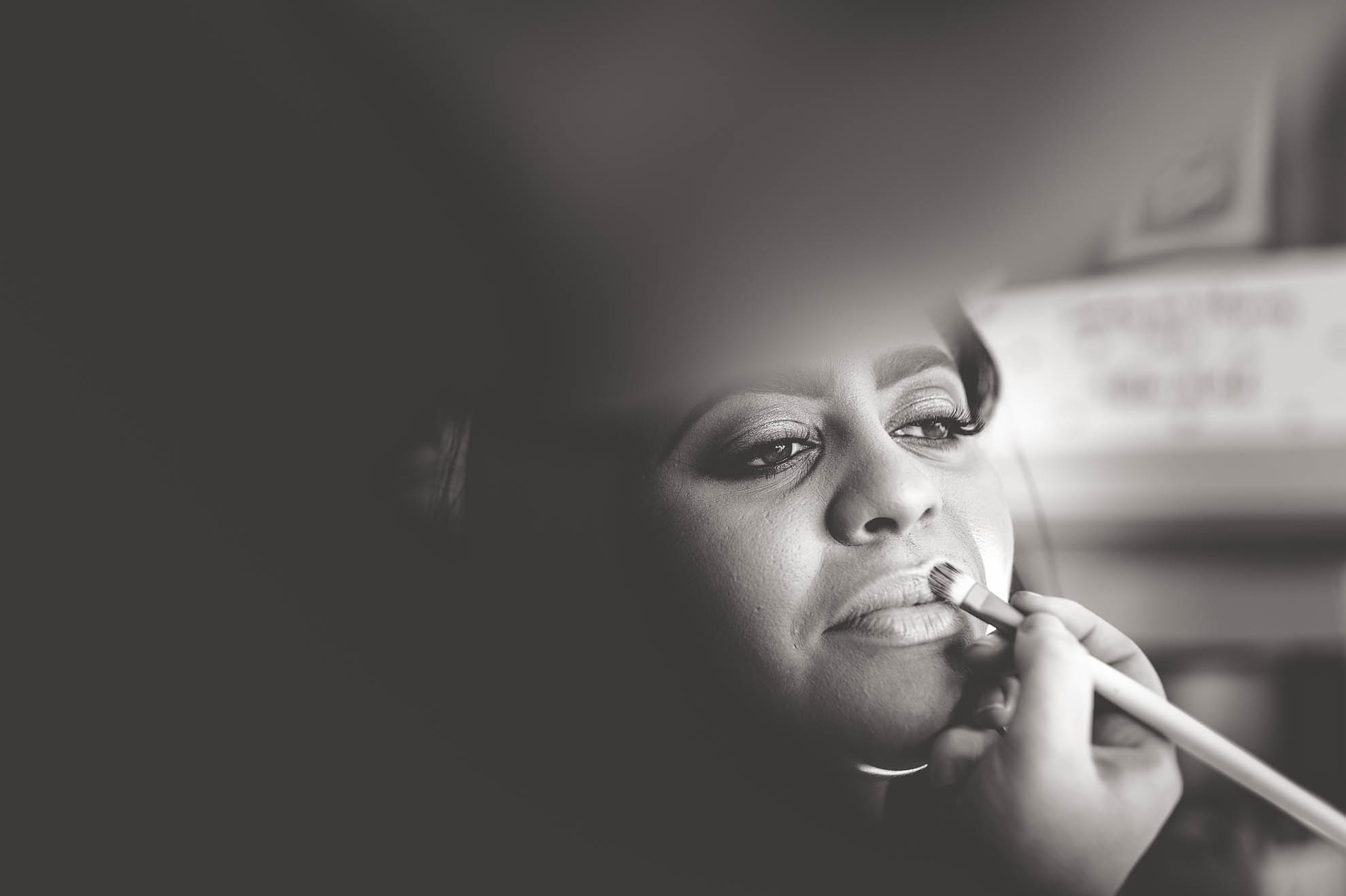 close up of bride having make up applied