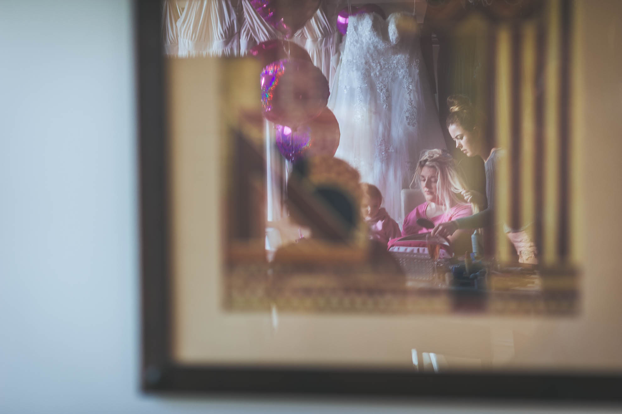 reflection of bridesmaid in mirror