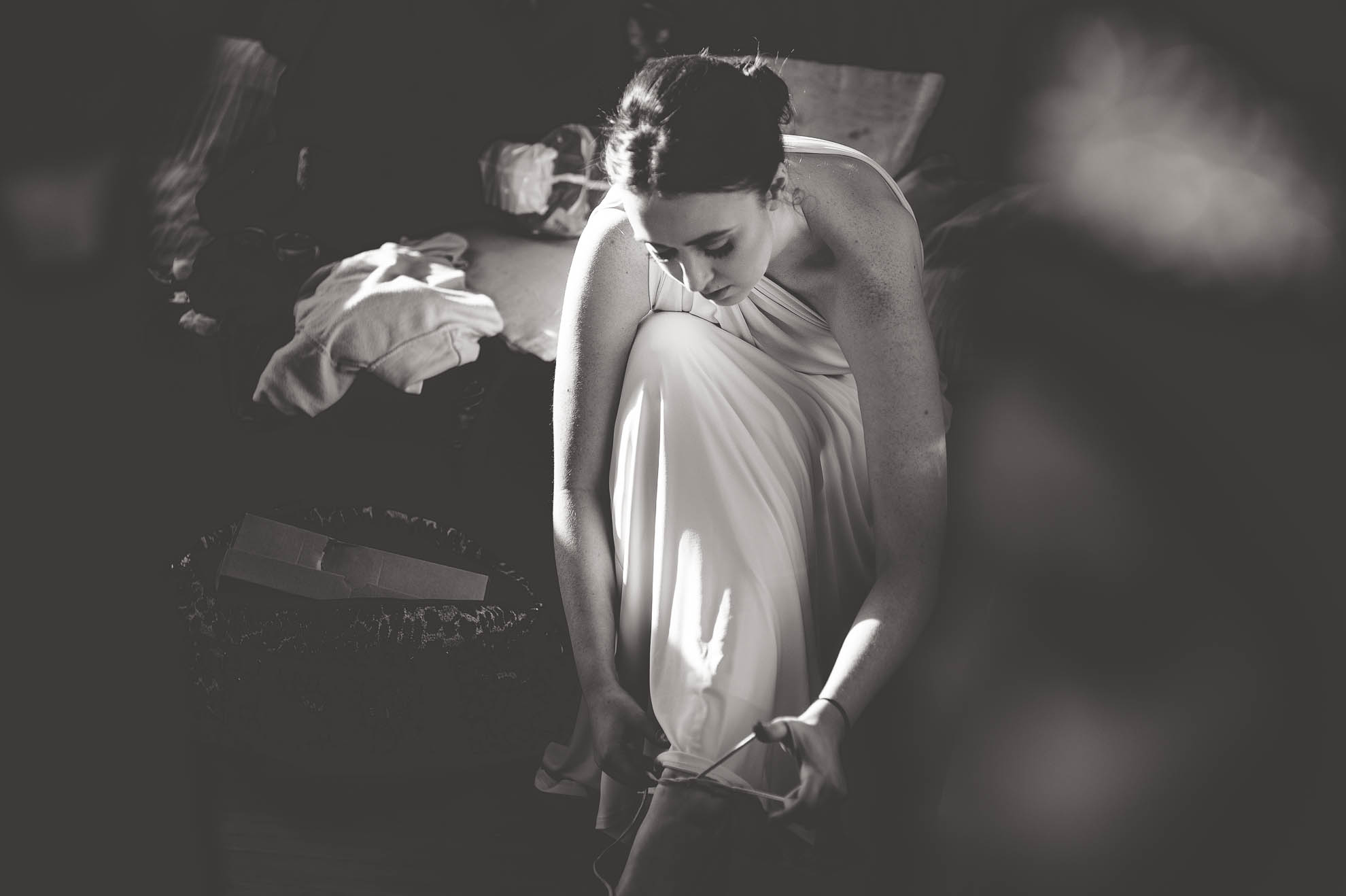 bridesmaid putting on her dress