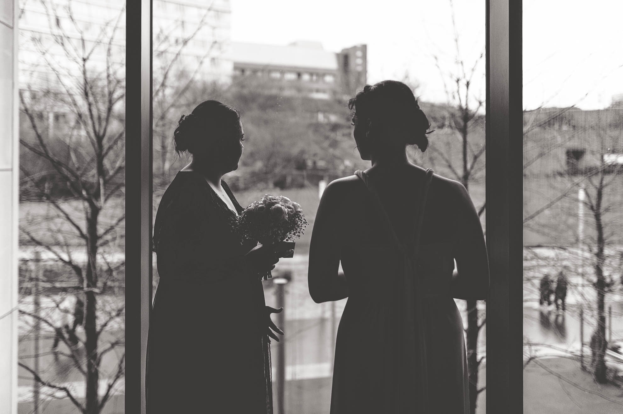 bridesmaids look out window
