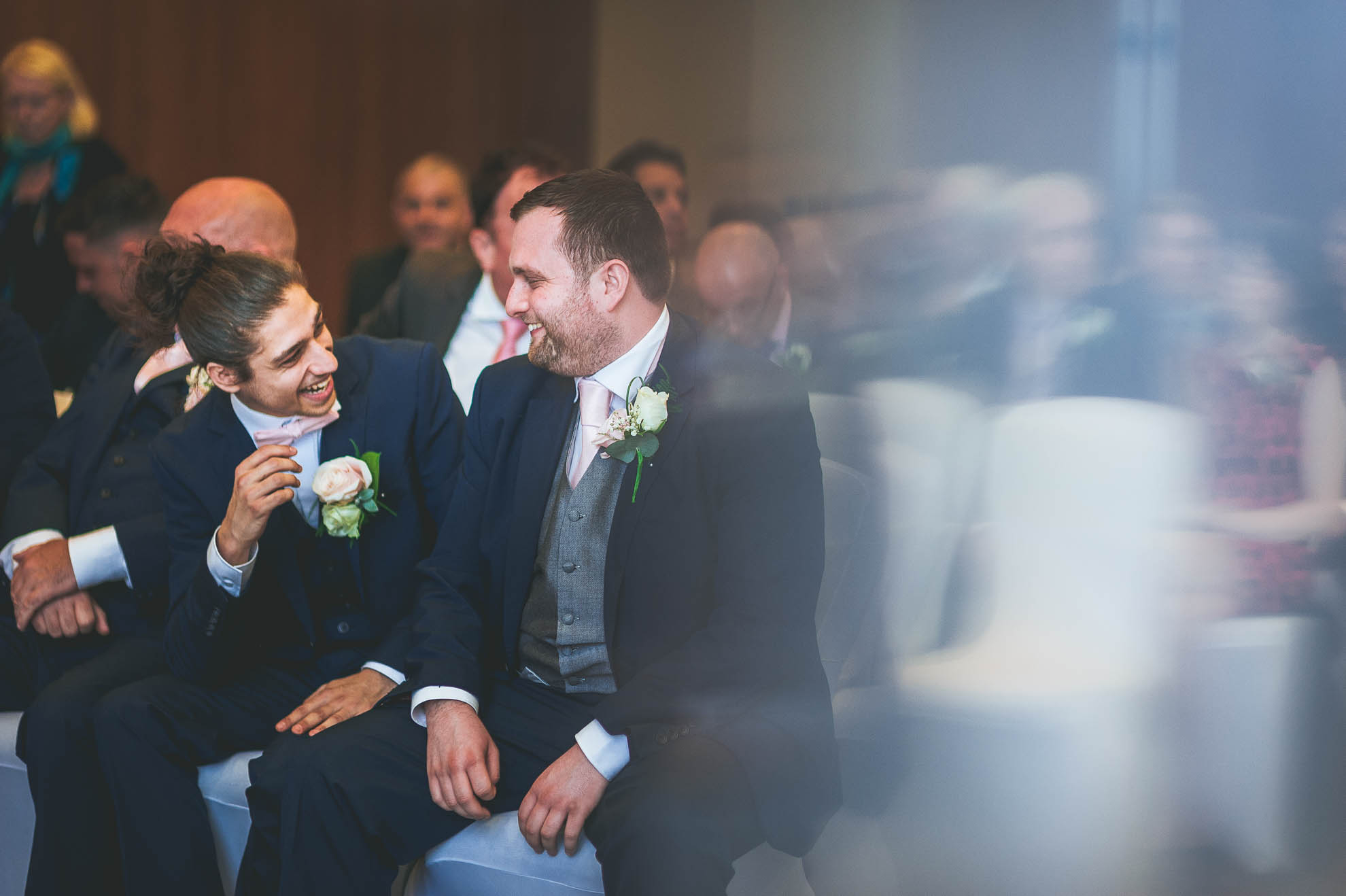groom and best man share a joke