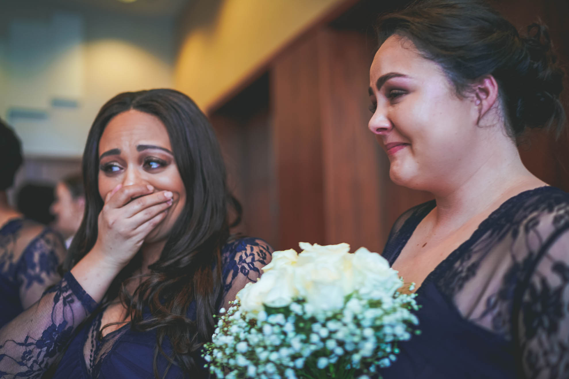 brides sister cries as bride walks up aisle