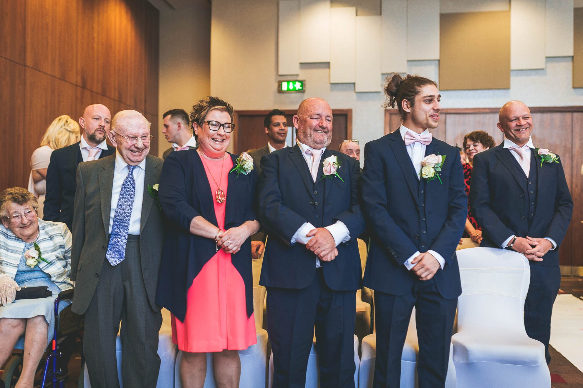 grooms family laugh