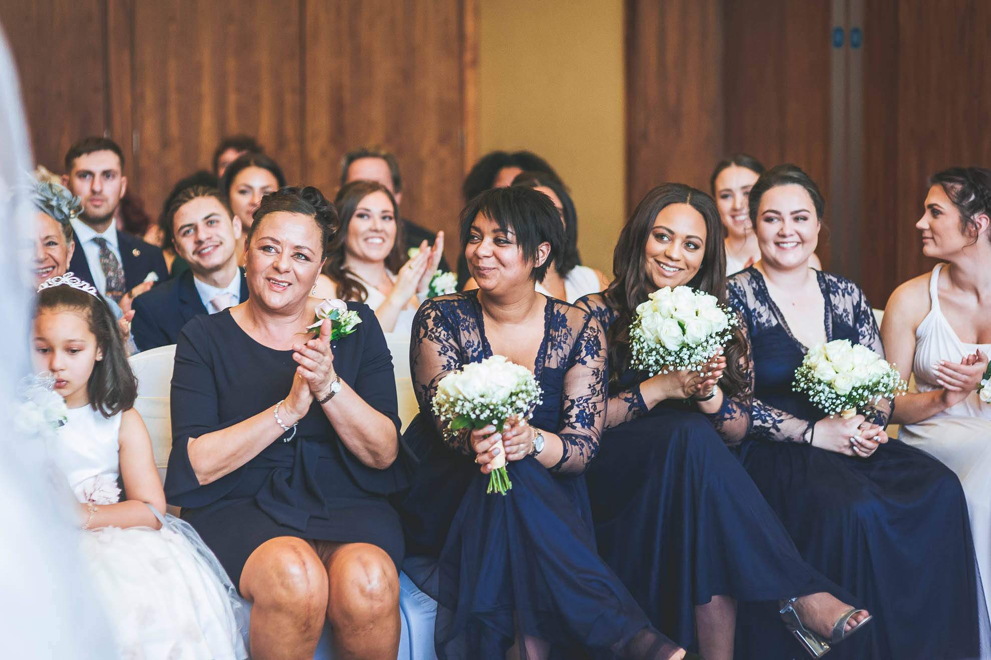 bridesmaids congratulate the happy couple