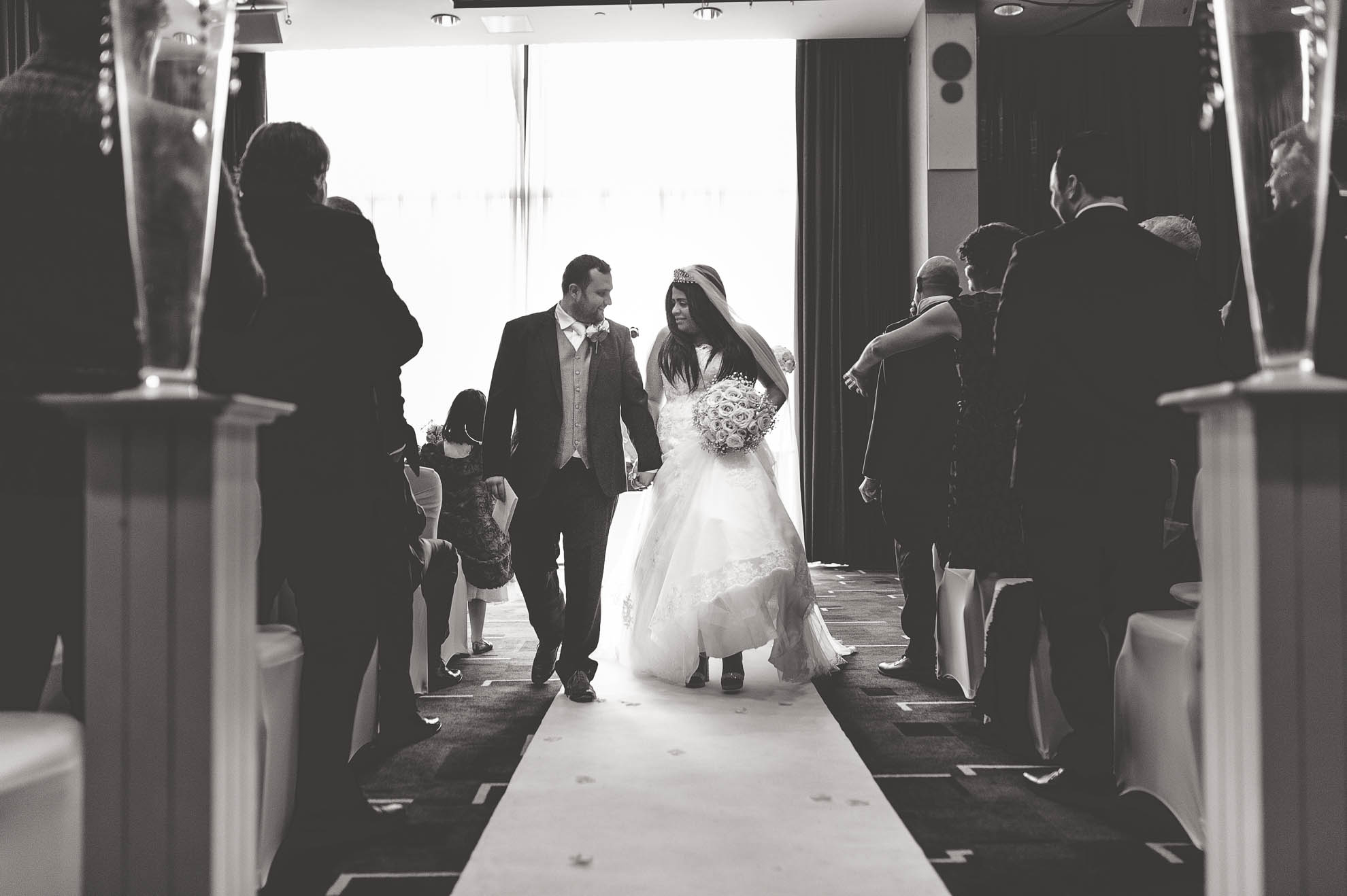 bride and groom walk back down the aisle