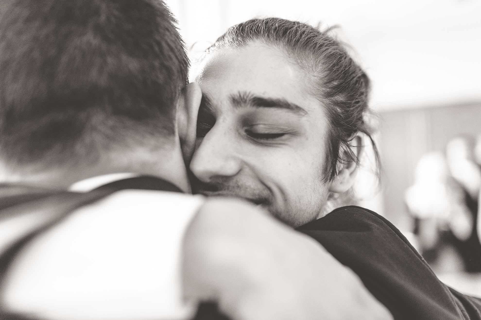 best man hugs groom