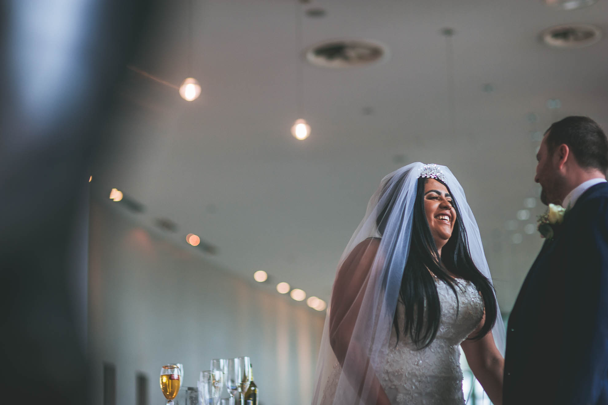 bride and groom laugh together