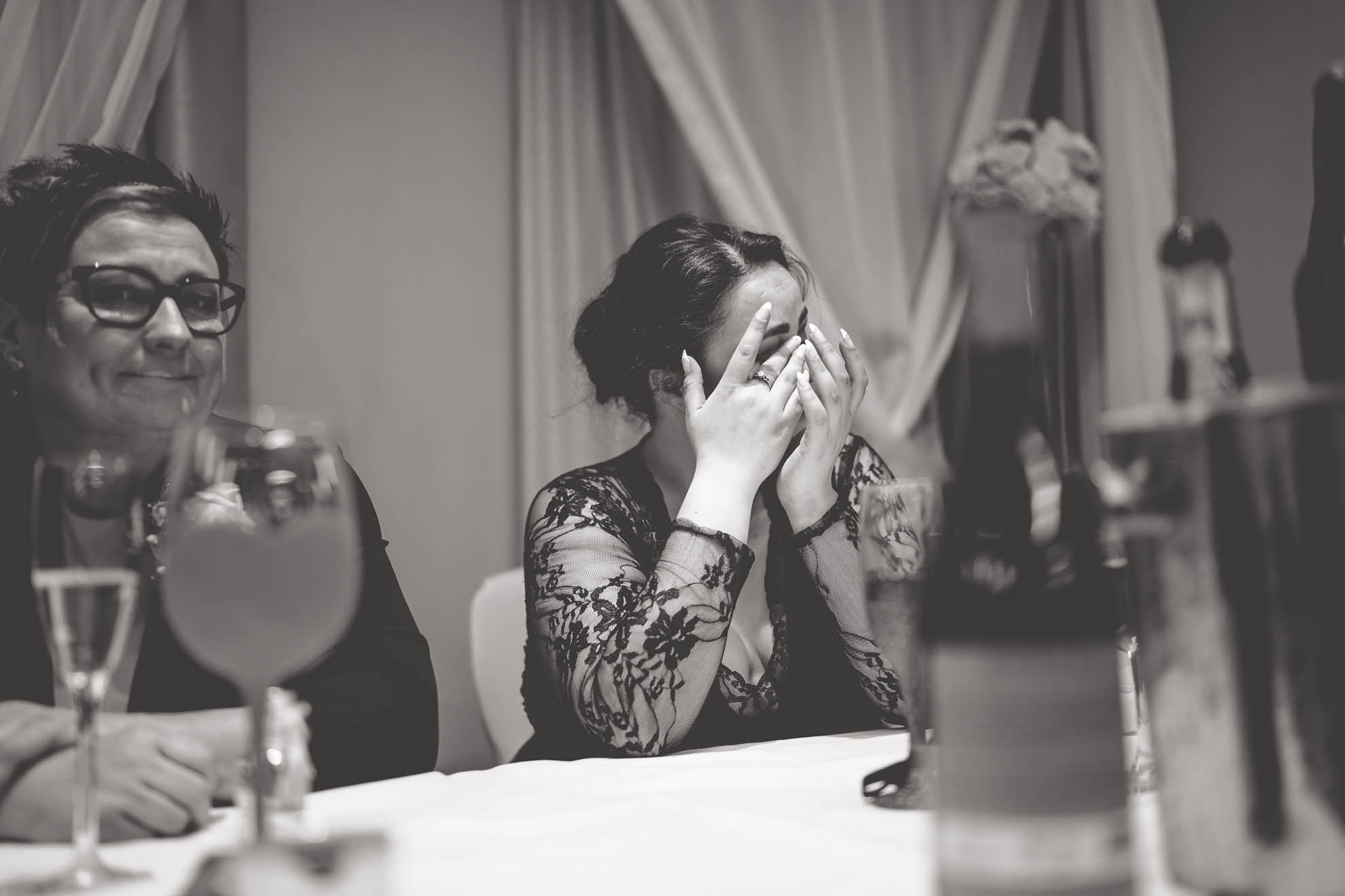 bridesmaid wipes away a tear