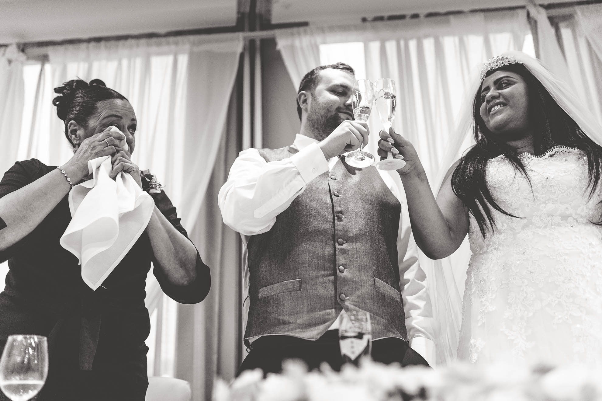 mother of the bride wipes way a tear