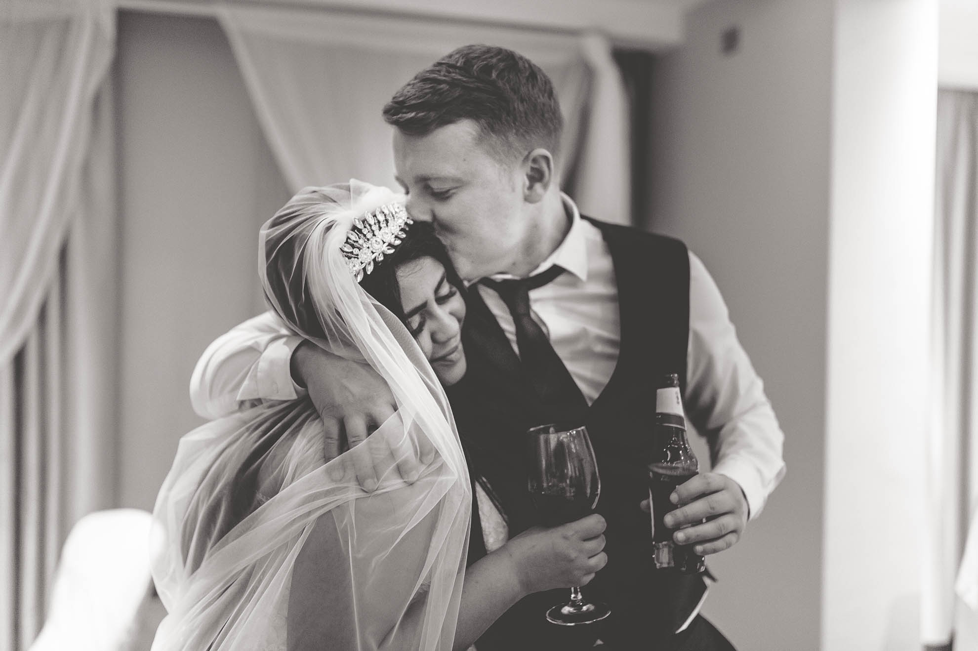 guest kisses bride