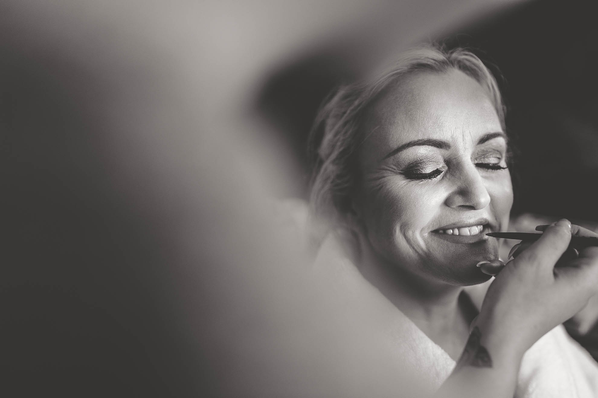 bride having her make up applied