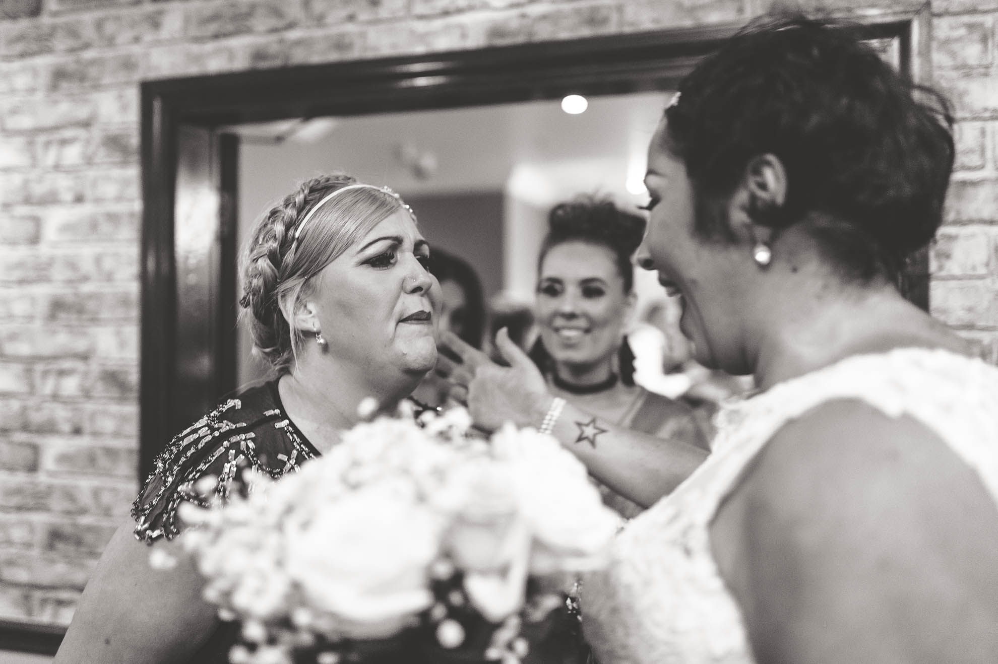 bridesmaid congratulating bride