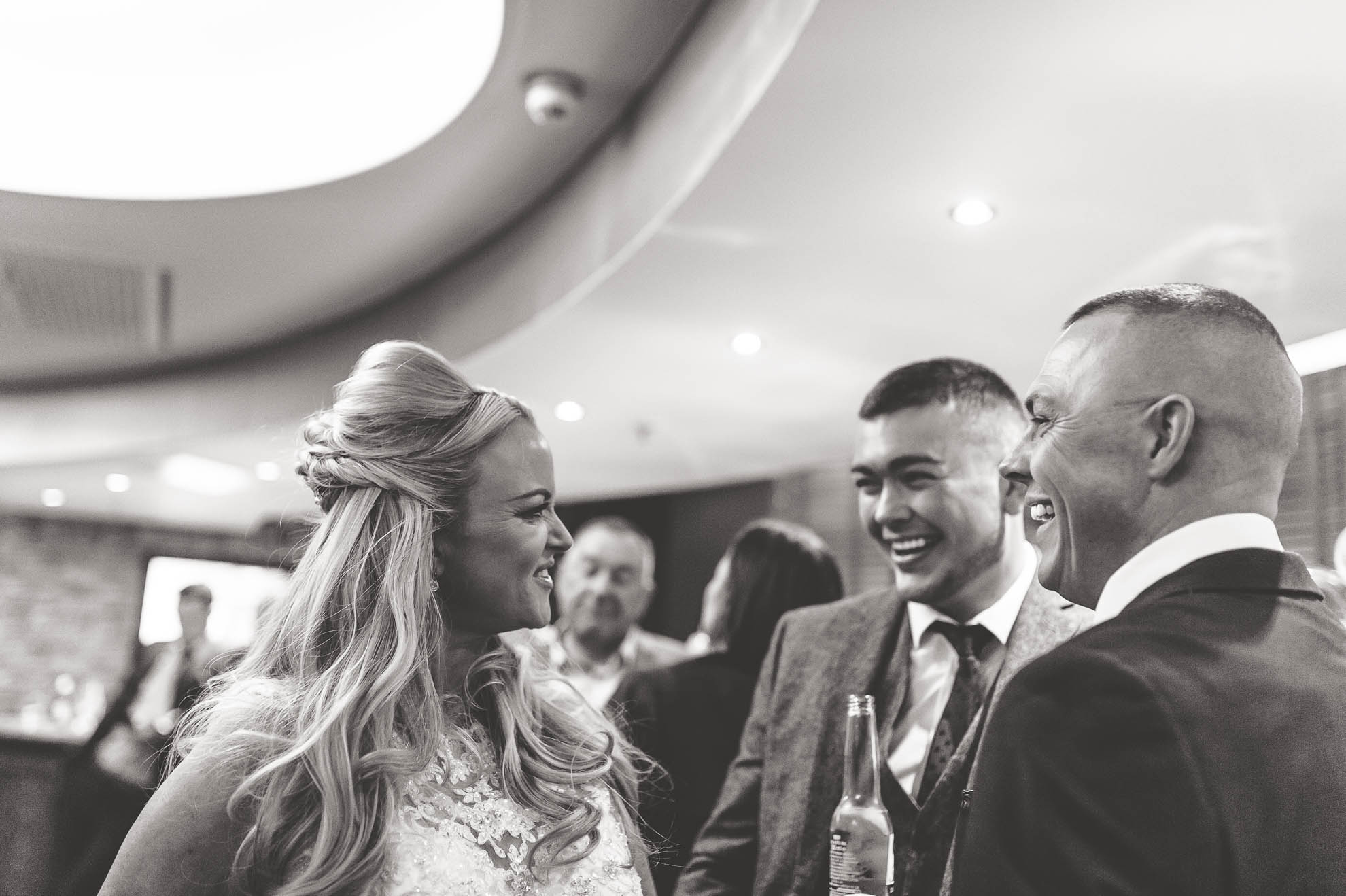bride sharing joke with guests
