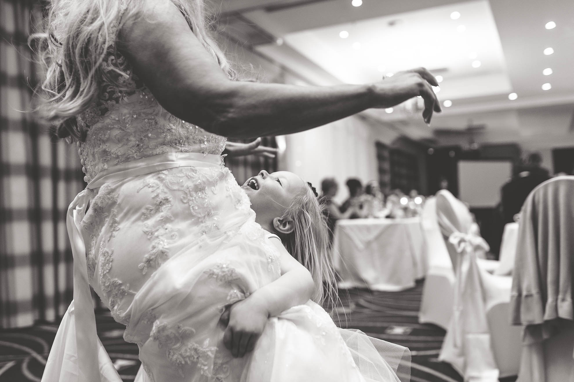 little girl holds bride