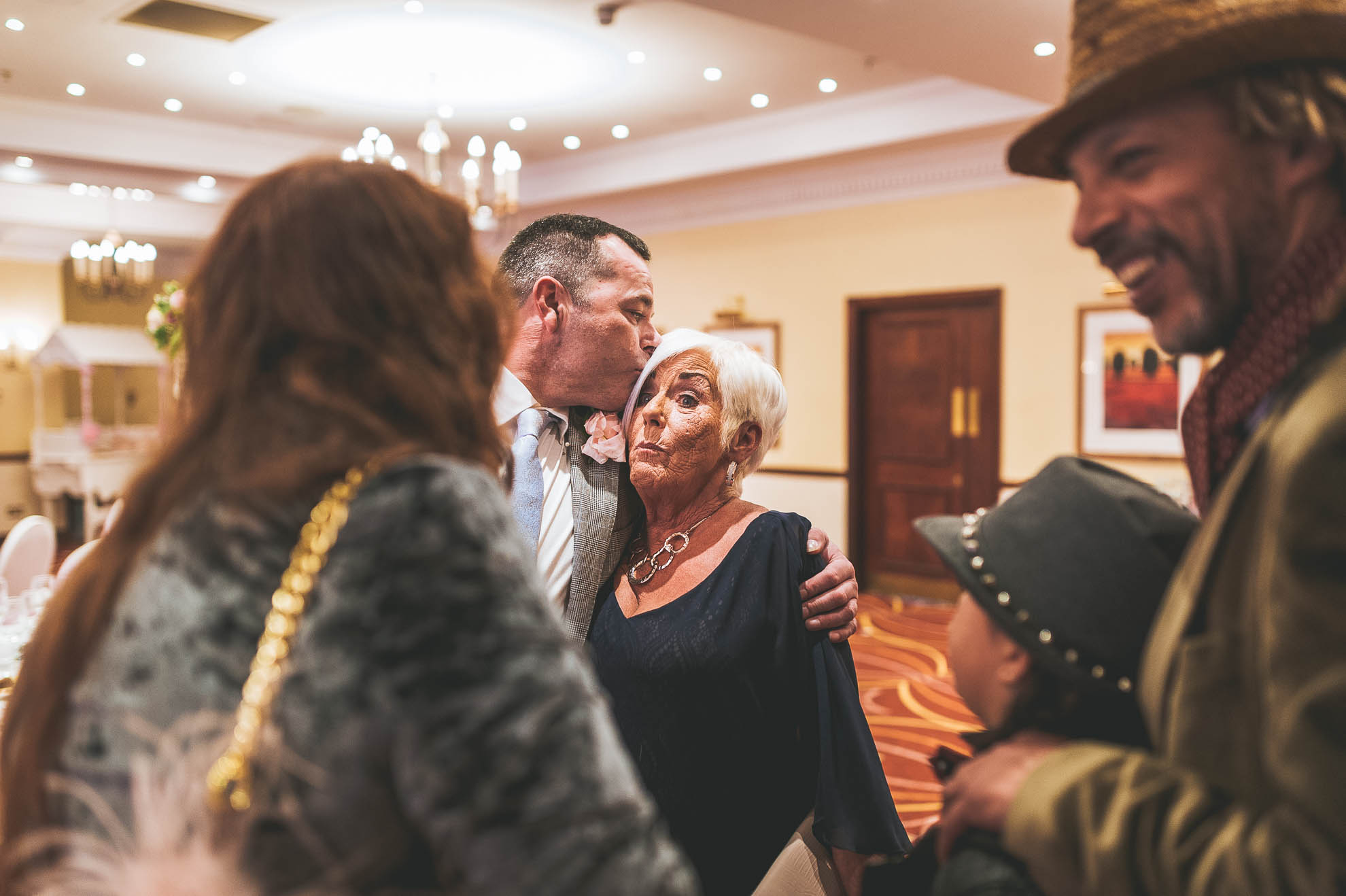 son giving mum a kiss
