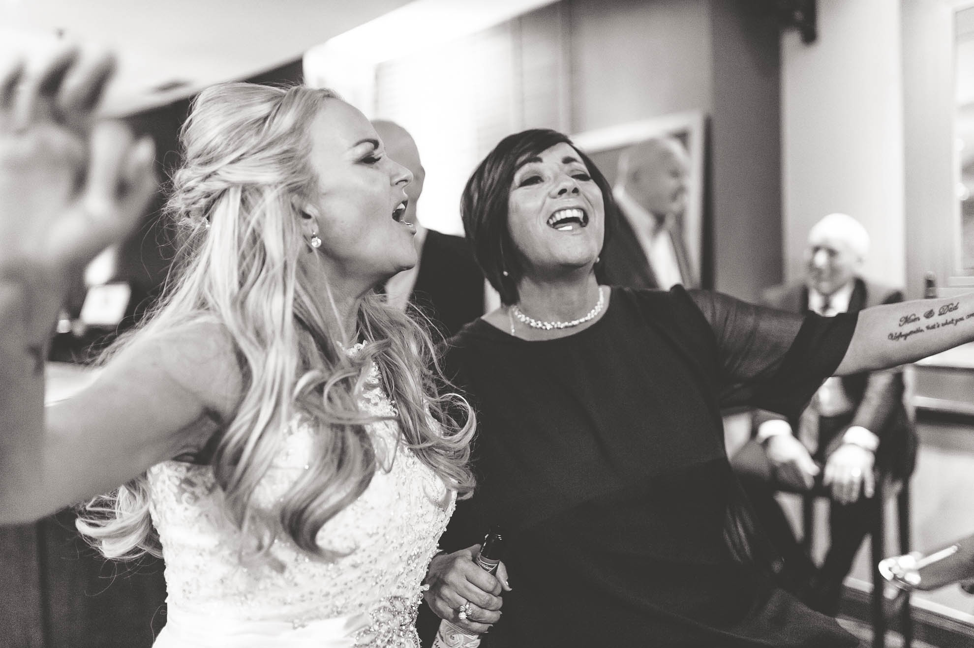 bride singing with guest