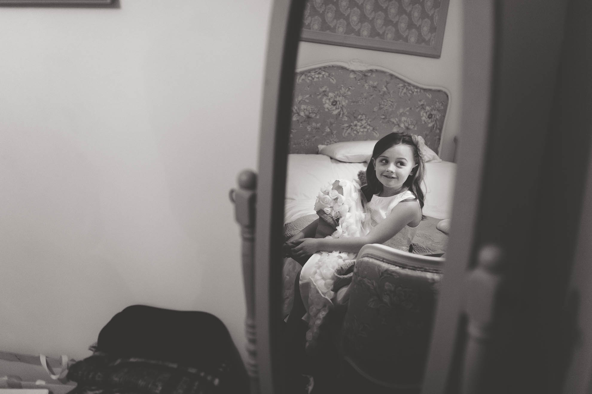 little girl reflected in mirror