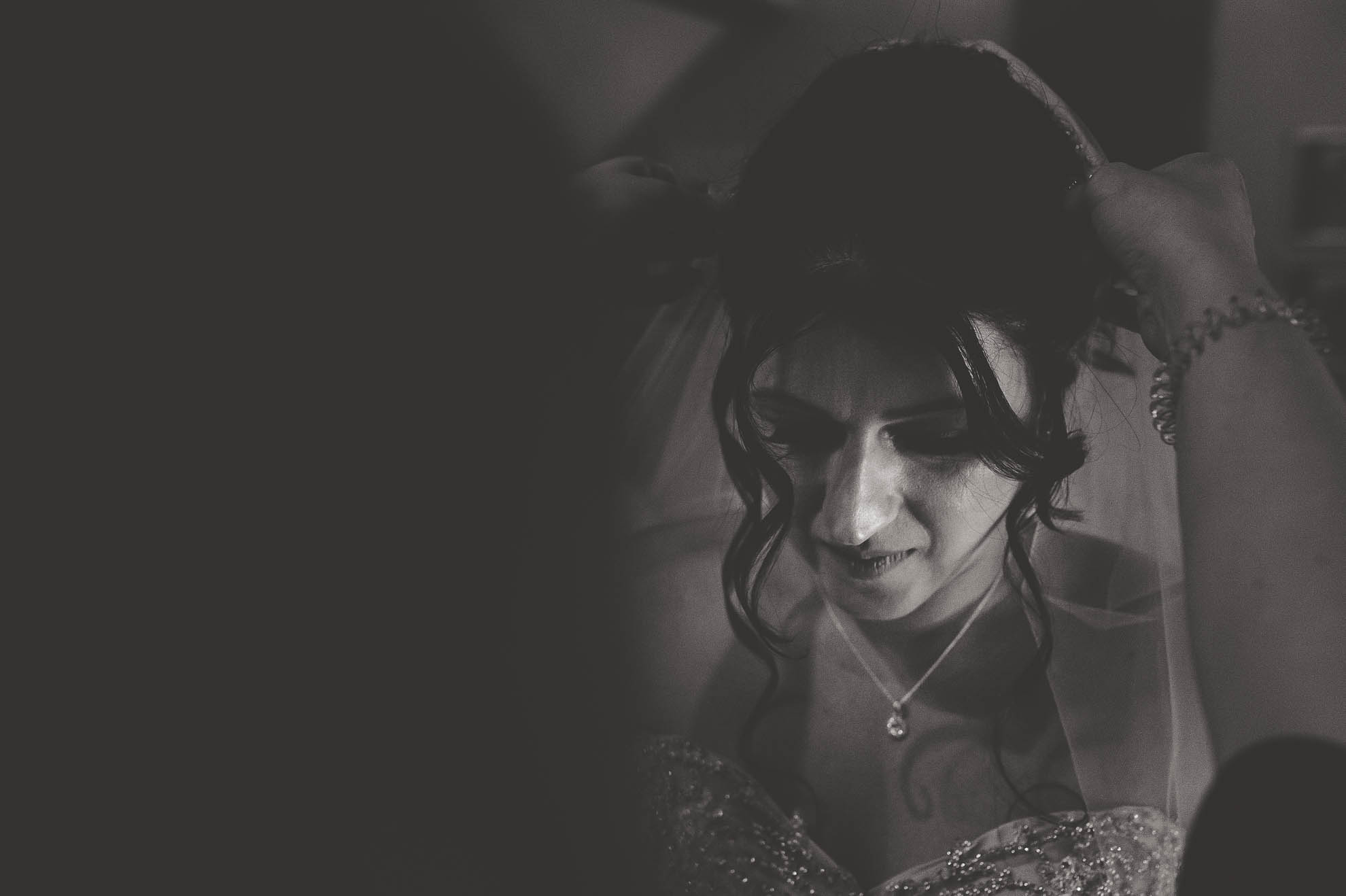 bride having her veil adjusted