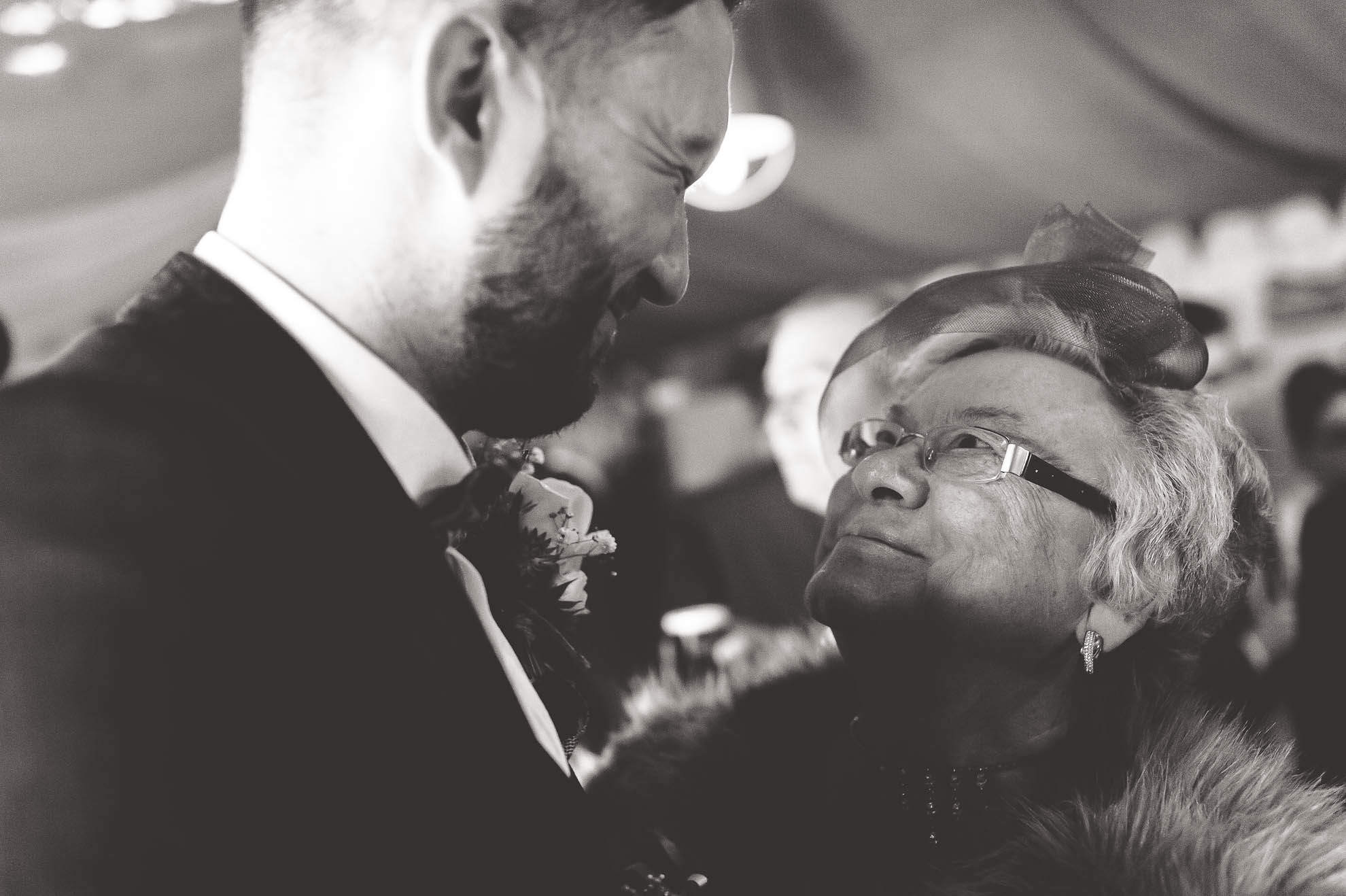 the groom and a guest share a joke