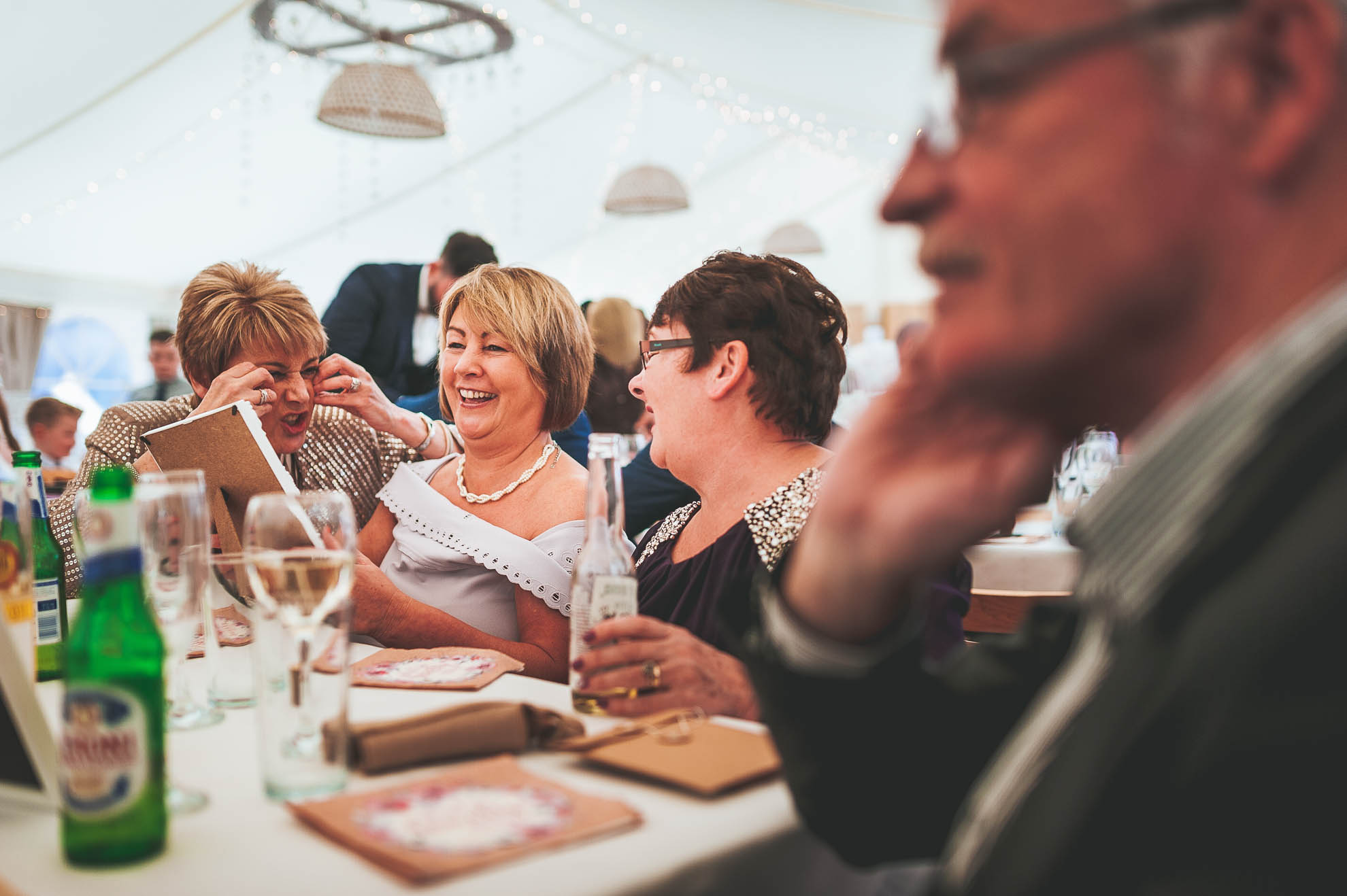 Guests share a joke at wedding breakfast