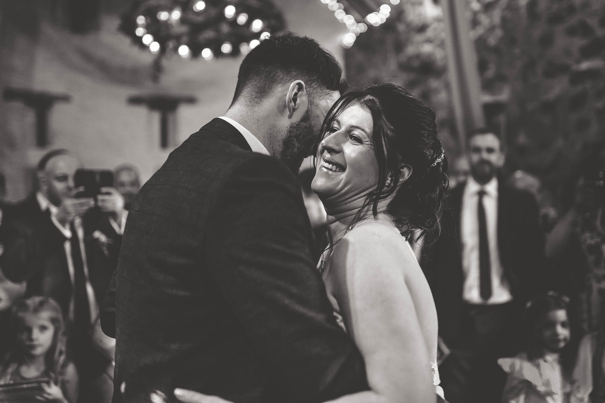 Bride laughs during first dance