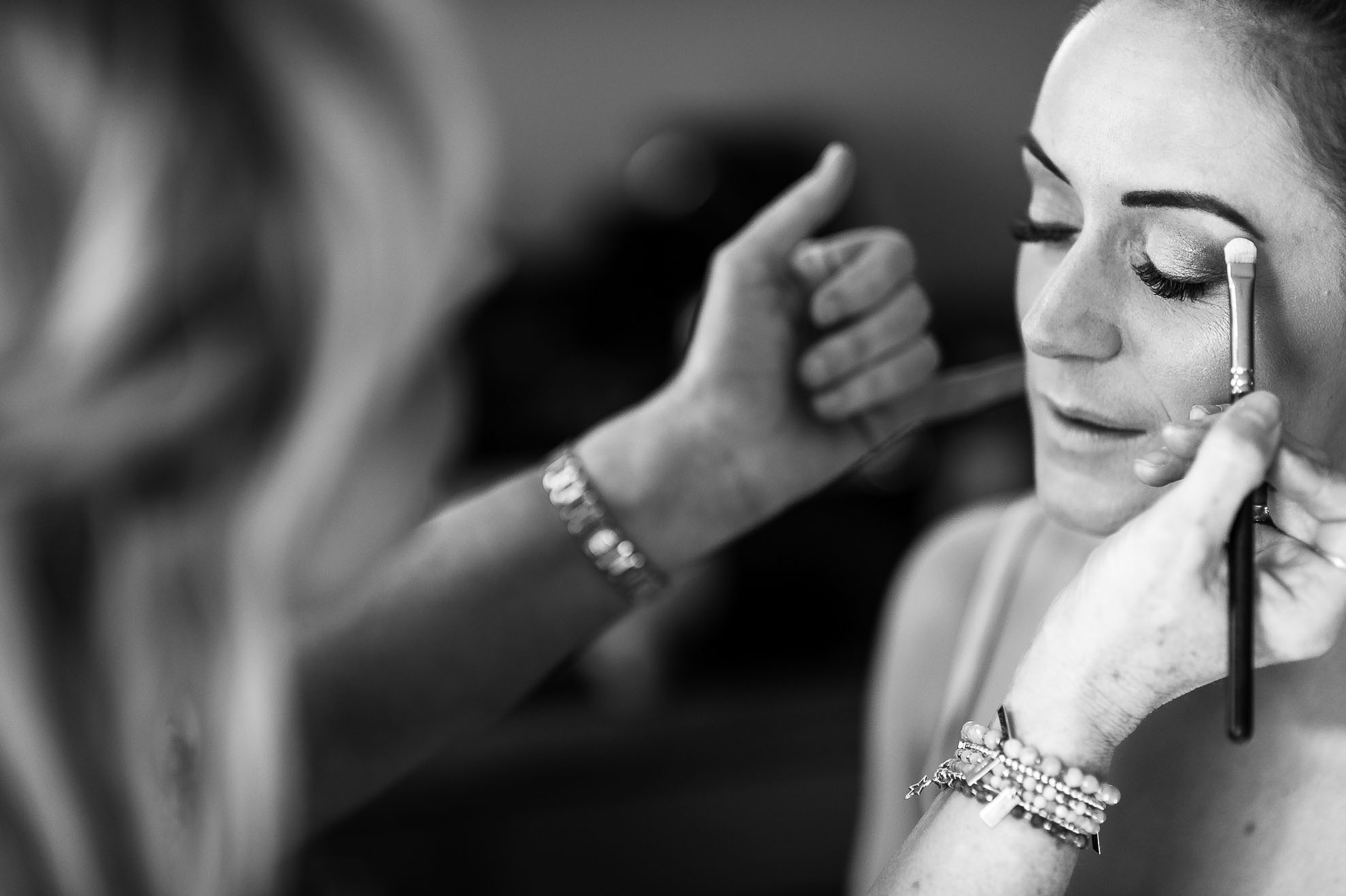 Bride having make up applied