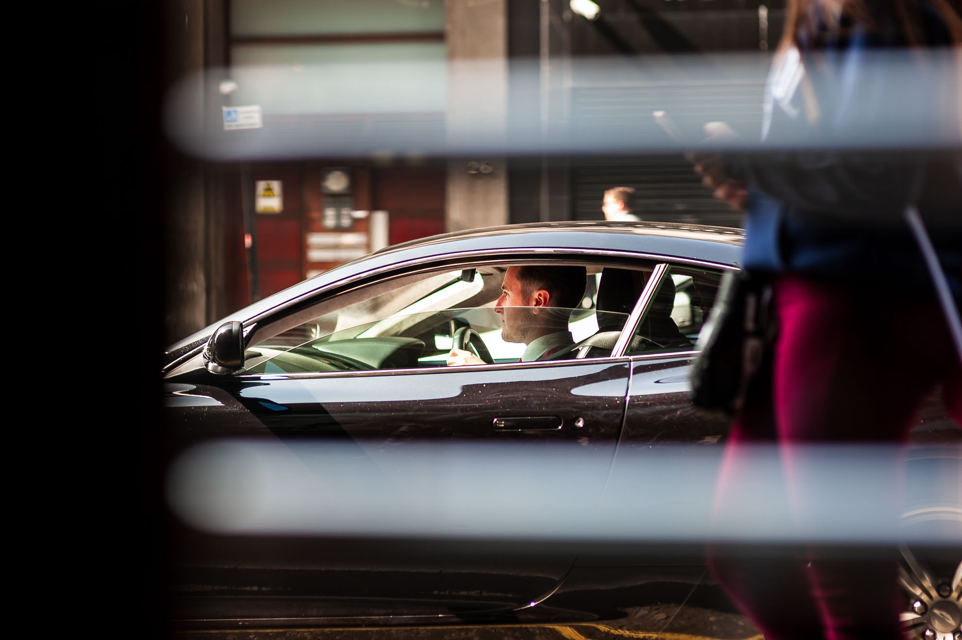 Groom arrives in an Aston Martin