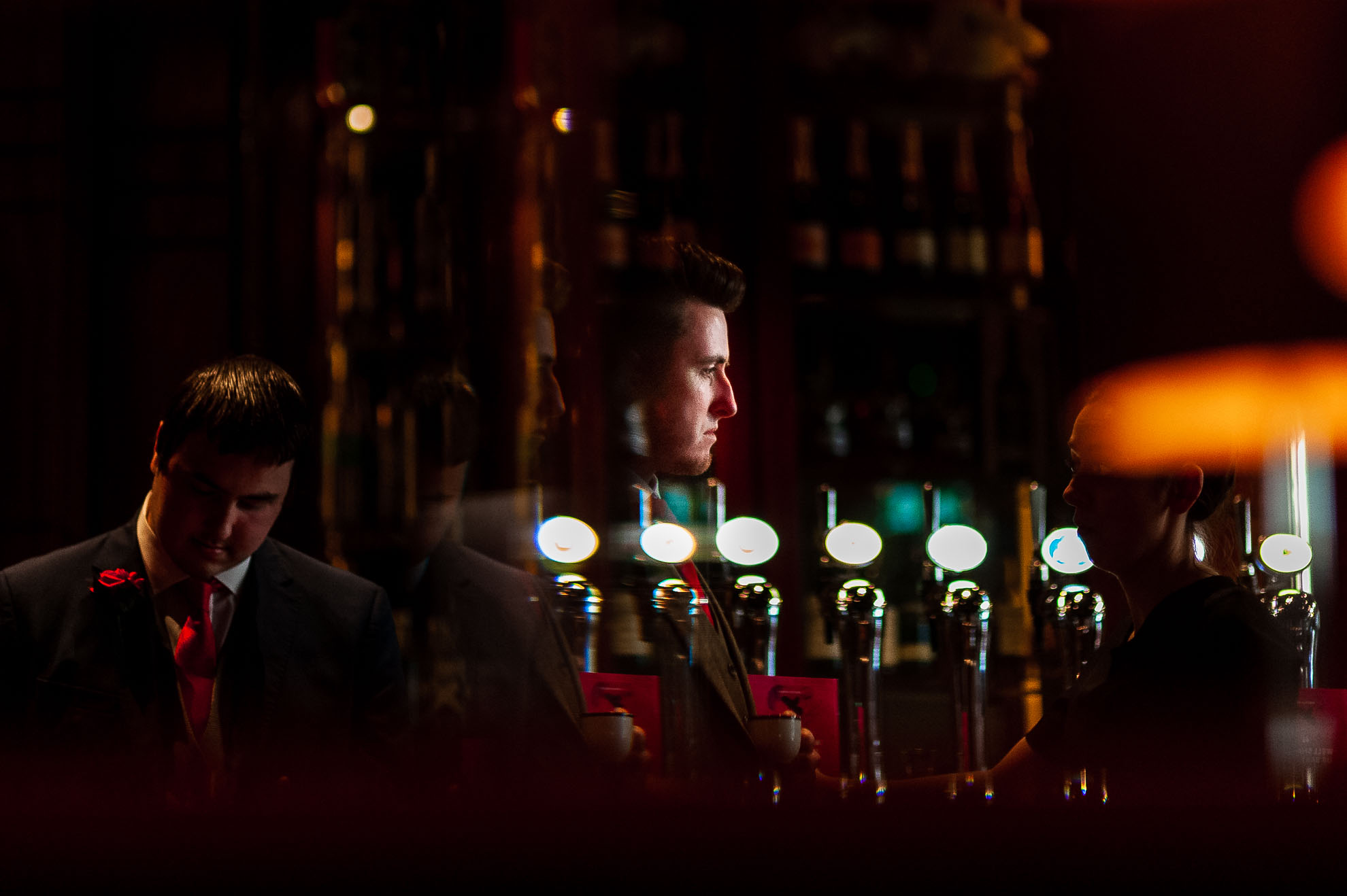 Groom reflection in mirror