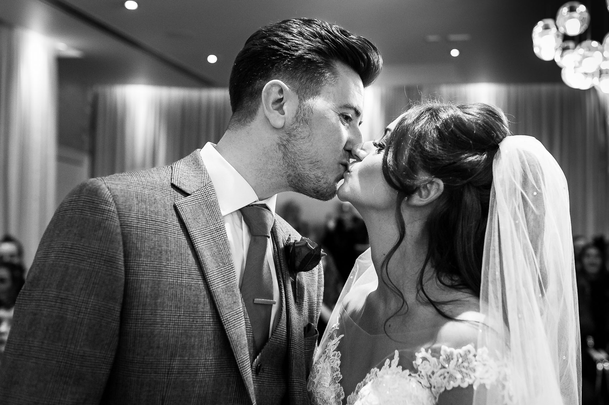 Bride and groom first kiss