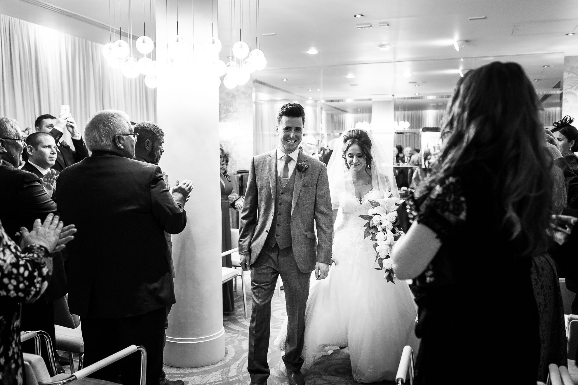 Bride and groom walk back down the aisle