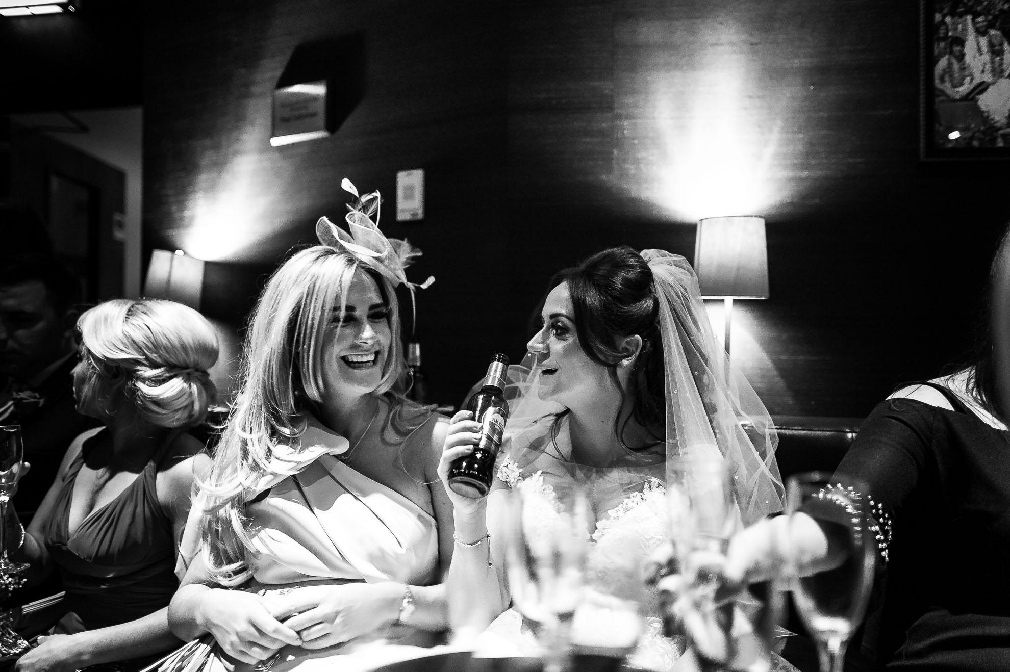 Bride shares a joke with wedding guest