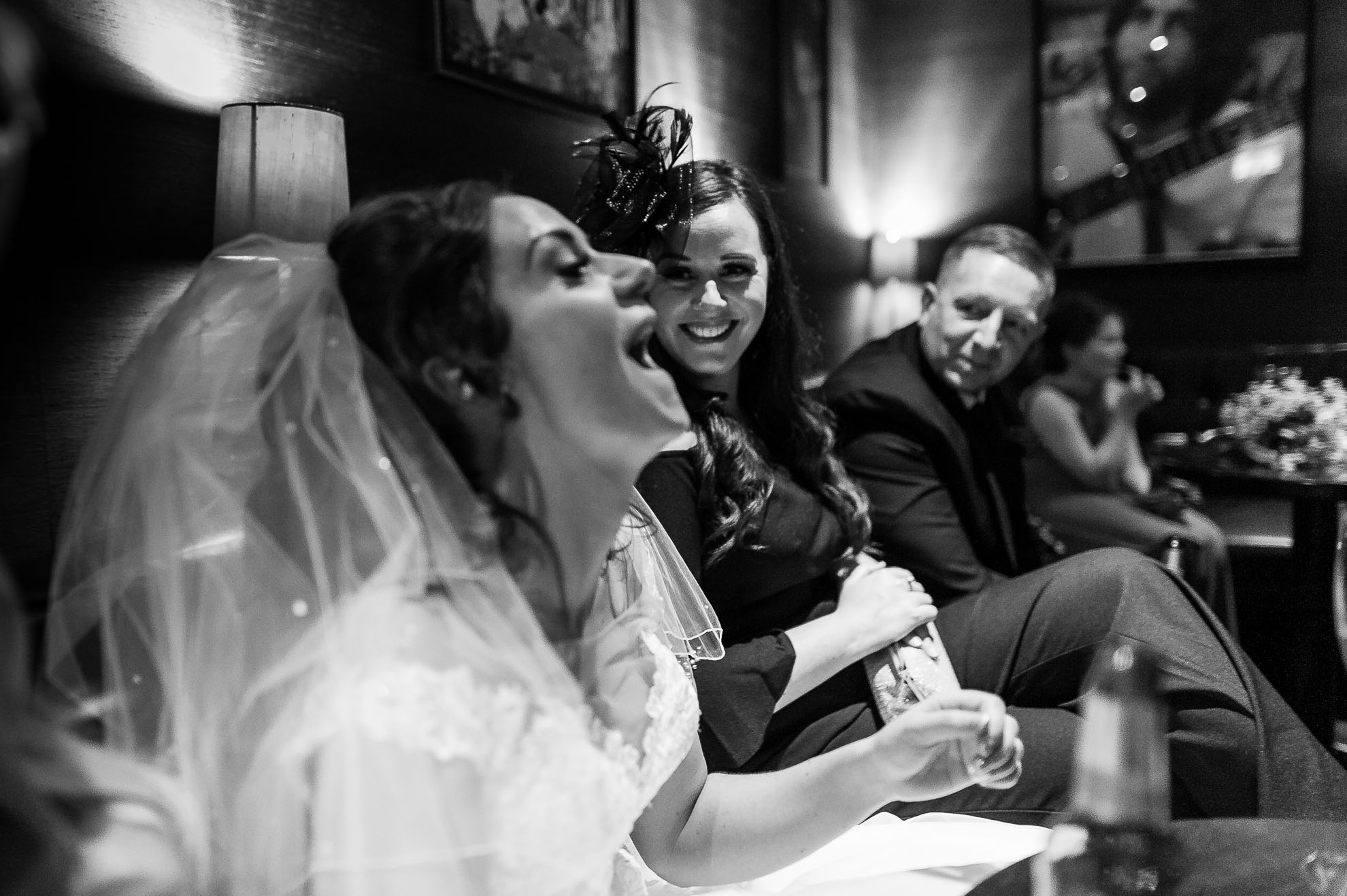 Bride laughs at guests joke