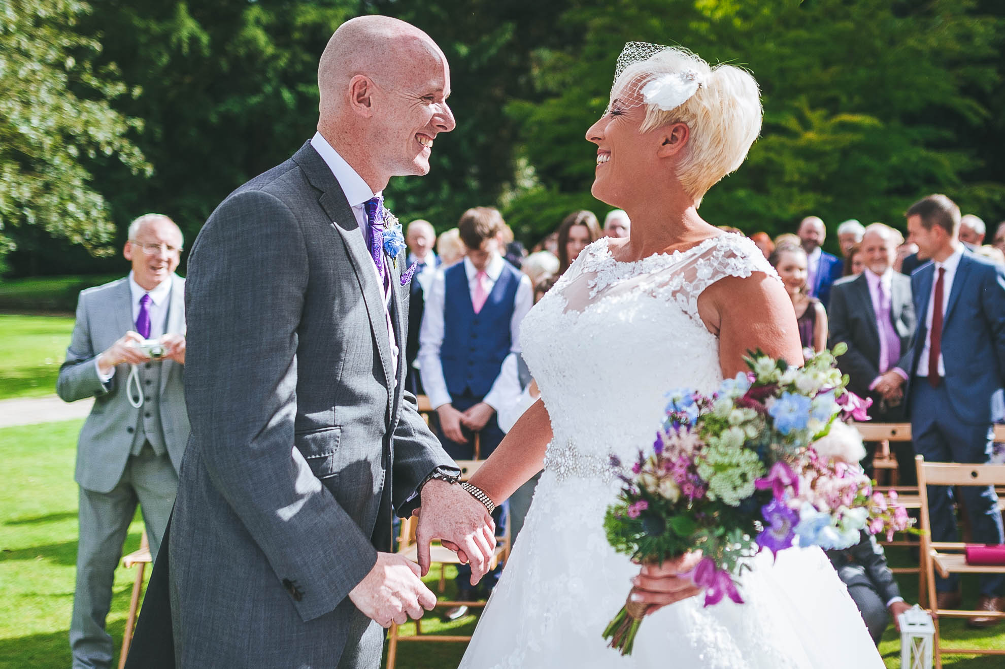 Bride and groom smile at each other