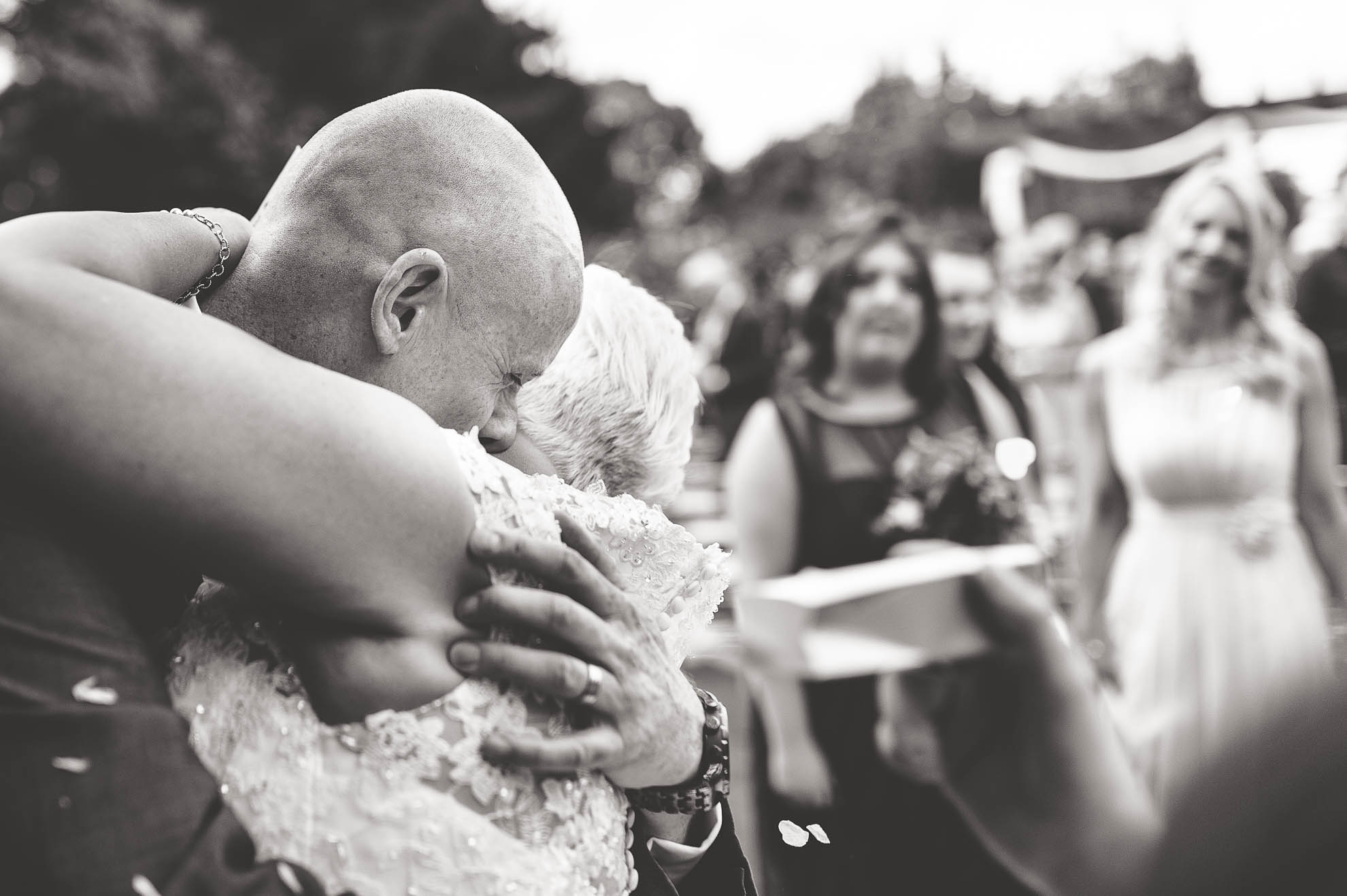Bride and groom hug
