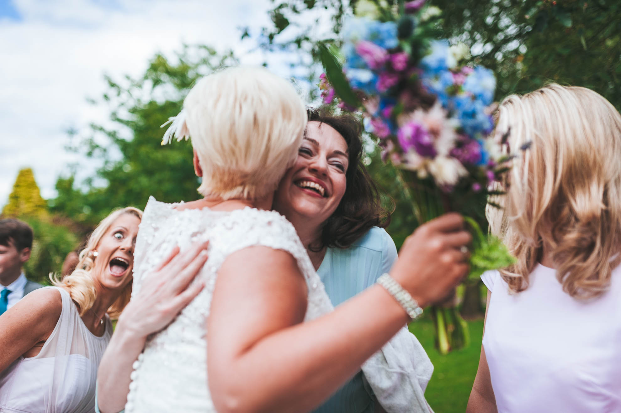Guest hugs the bride
