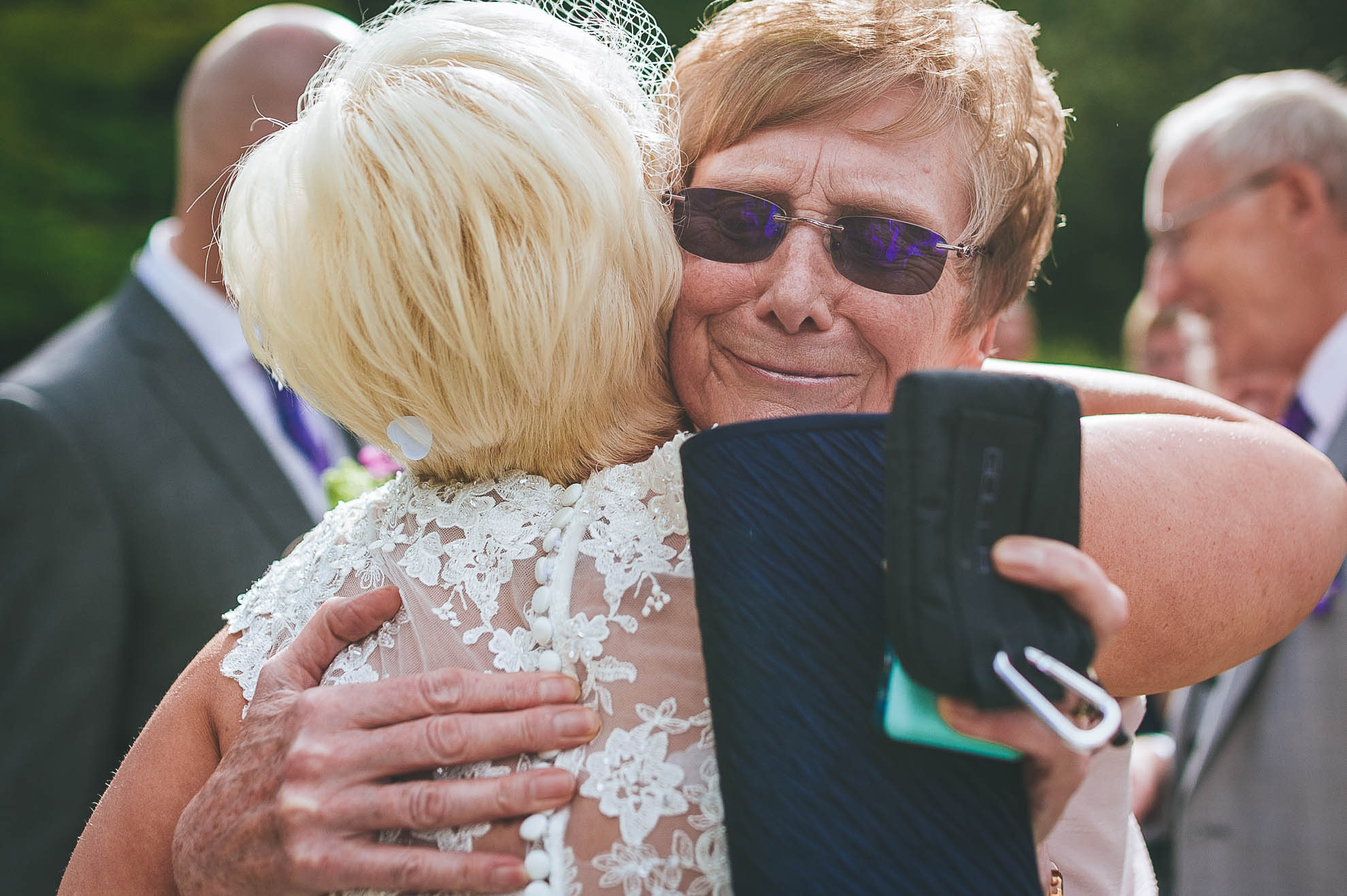 Guest hugs the bride