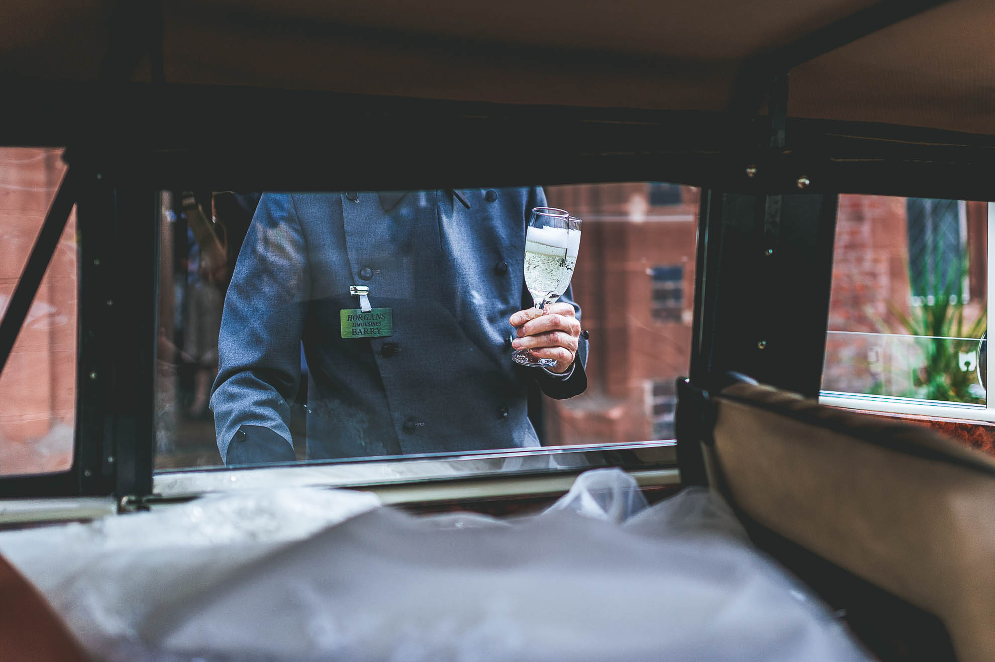 Chauffer with two glasses of champagne