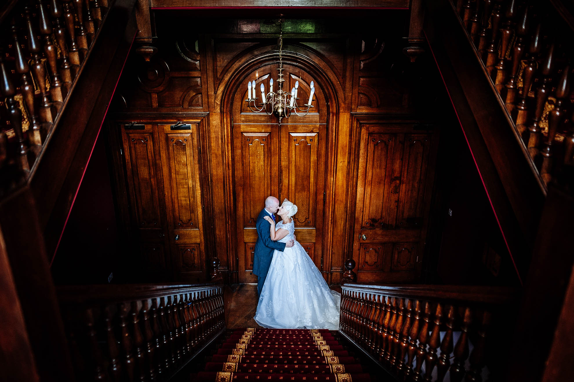 Bride and groom portrait in front of door