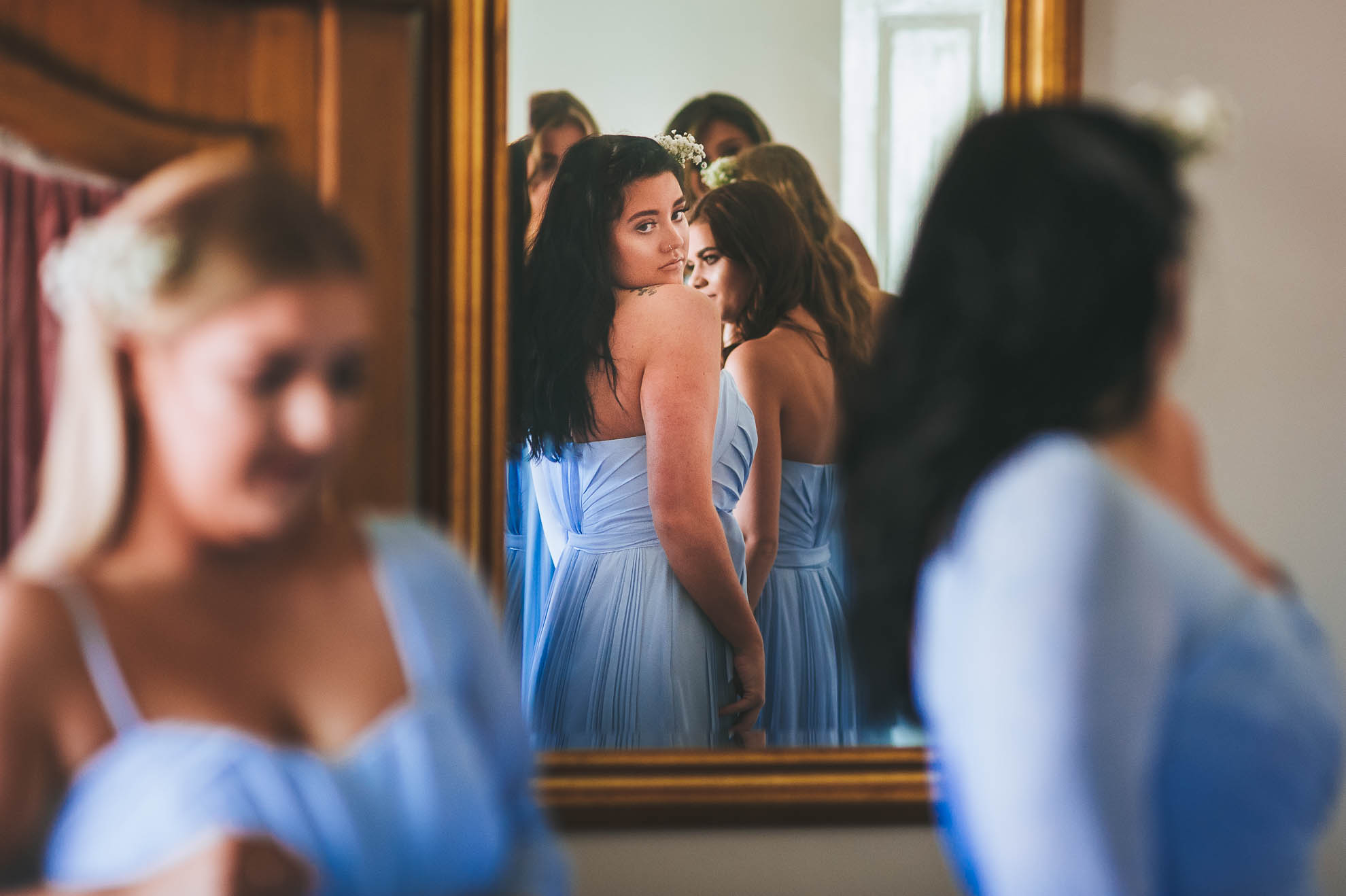 Bridesmaid looks in mirror