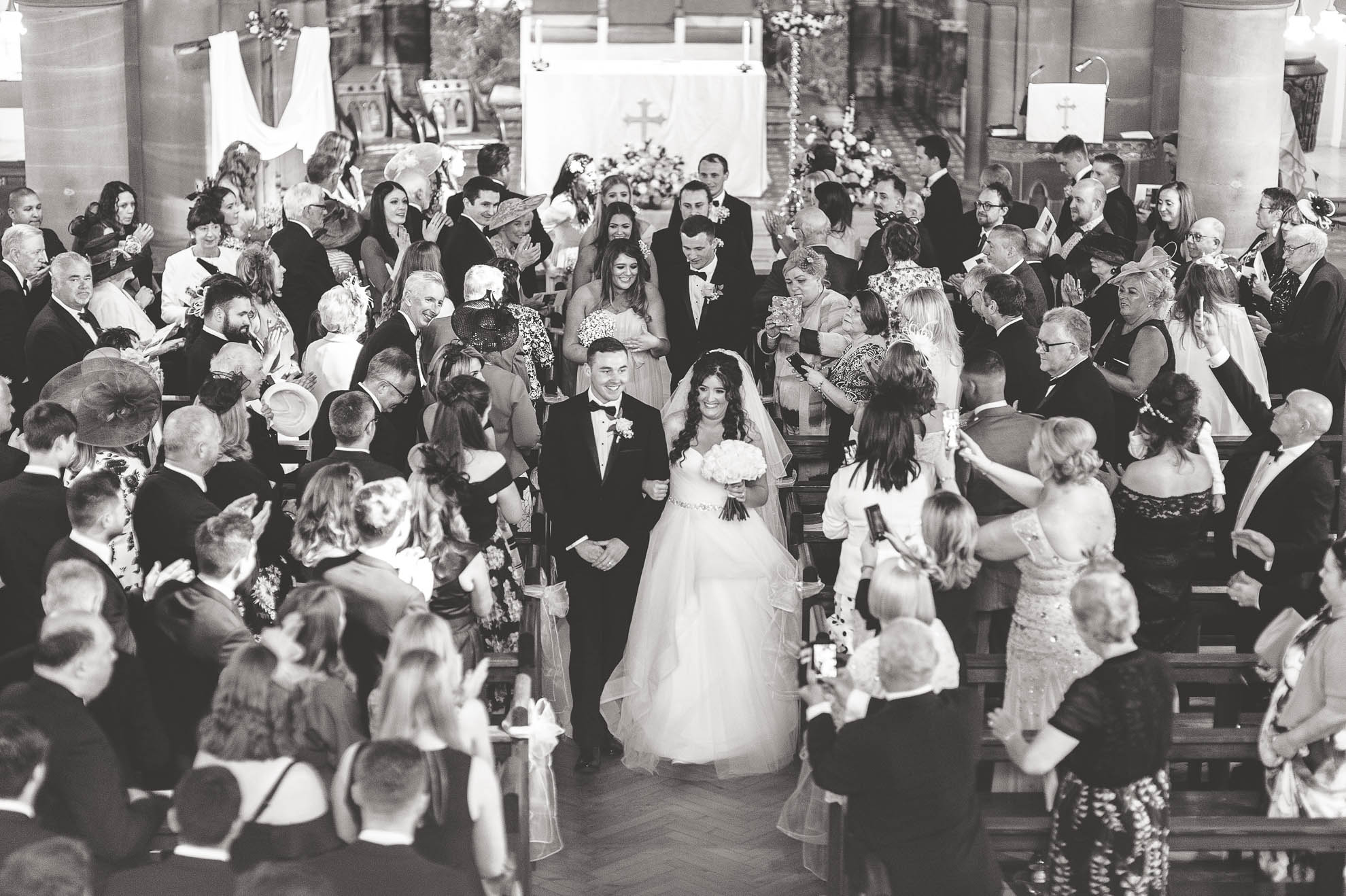 Bride and groom walk back down the aisle